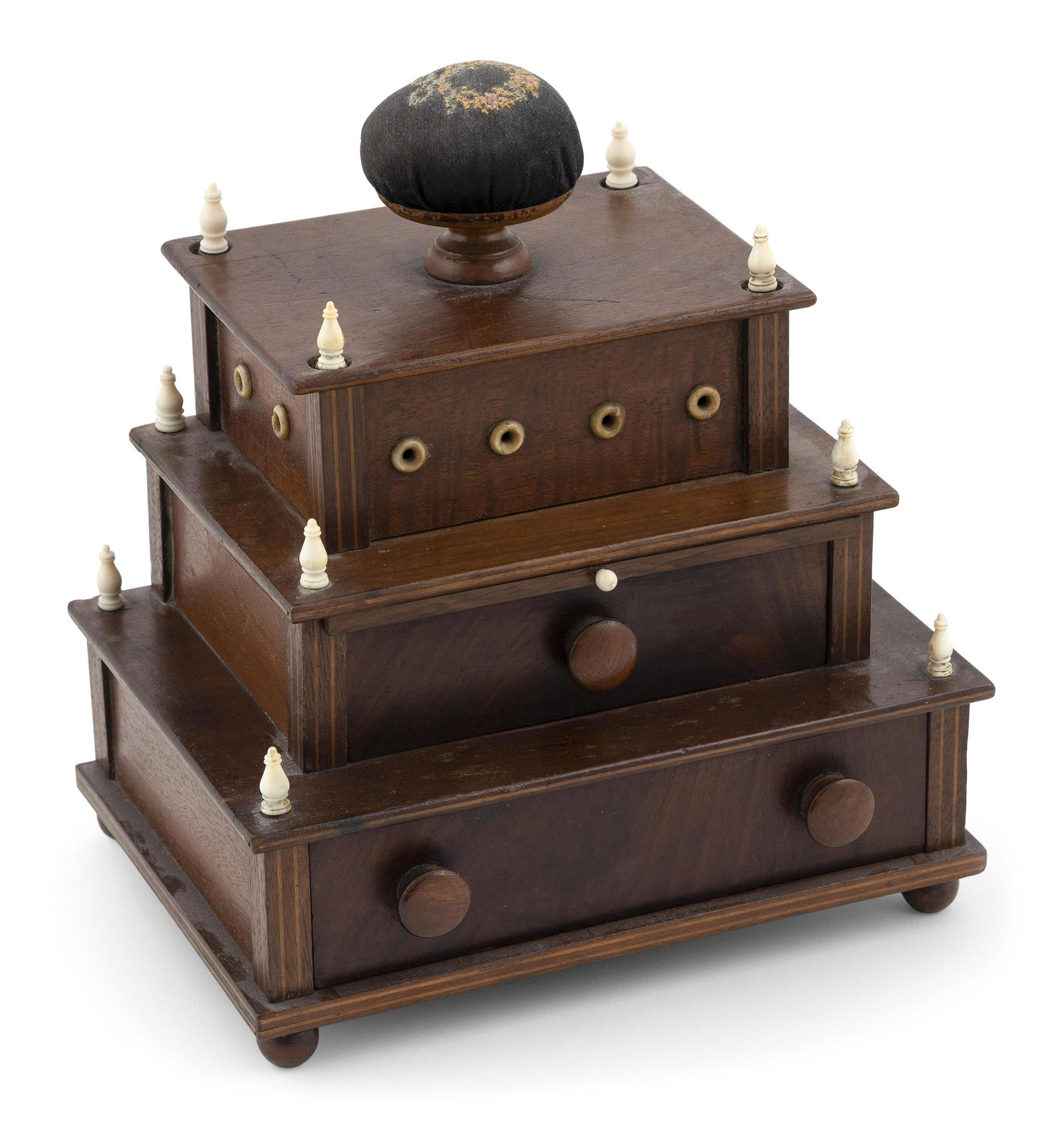 SAILOR-MADE THREE-TIER SEWING BOX 19th Century Height 9.5”. Width 9”. Depth 6.5”.: SAILOR-MADE THREE-TIER SEWING BOX 19th Century Upper tier topped with a pincushion and with bone-lined thread dispensing holes around perimeter. Lower tiers with a pull-out mirror and drawers. Bun fee