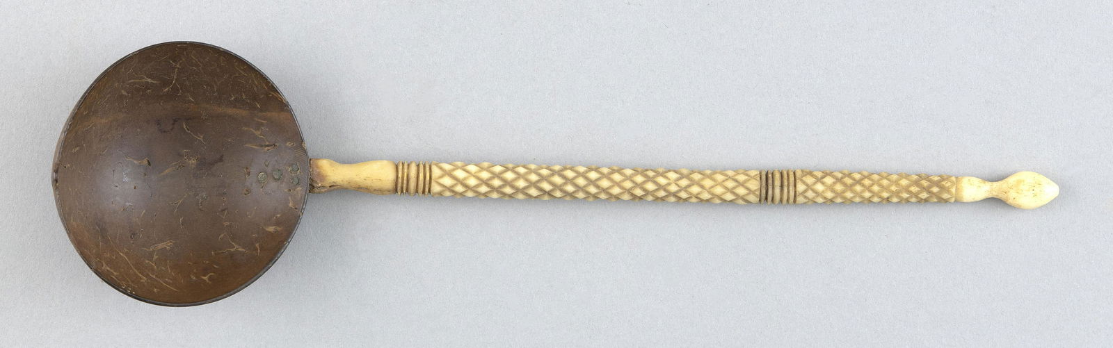 WHALEBONE AND COCONUT SHELL SPOON First Half of the 19th Century Length 10”. (1 of 2)