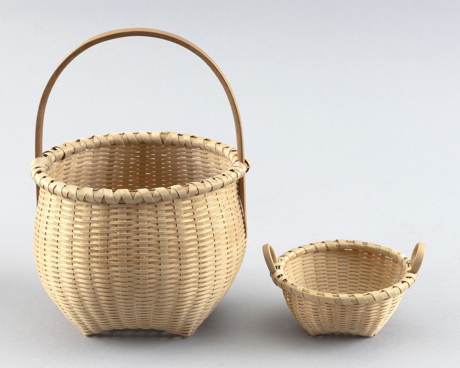 TWO WOVEN BASKETS BY JOAN CASHIN Contemporary Diameters 3.5” and 5”. (1 of 2)
