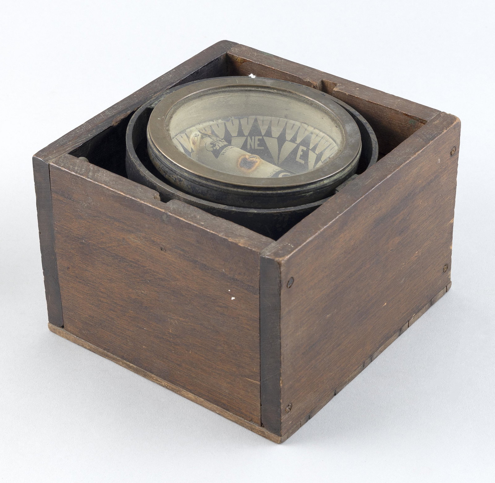 BOXED COMPASS BY E.S. RITCHIE, BOSTON Circa 1878 Face diameter 4.75". Box height 5". Width 7". Depth: BOXED COMPASS BY E.S. RITCHIE, BOSTON Circa 1878 Signed on the card "Ritchie, Boston." and marked in points and degrees. This early gimballed compass exhibits an unusual feature in that the 