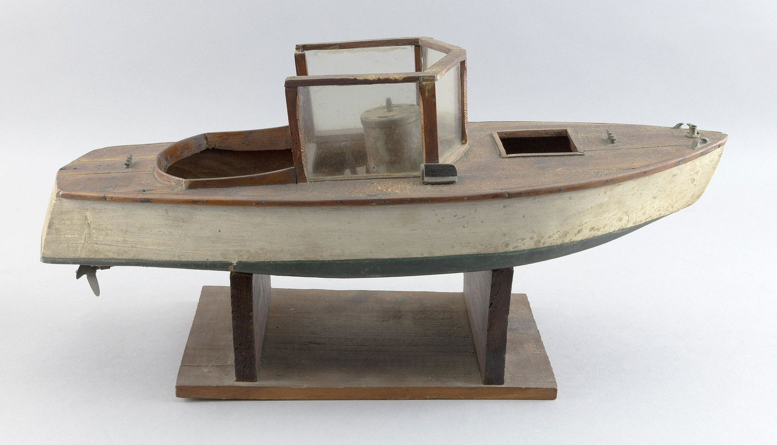 MODEL OF A MOTOR BOAT First Half of the 20th Century Total height 10”. Length 21”. (1 of 3)
