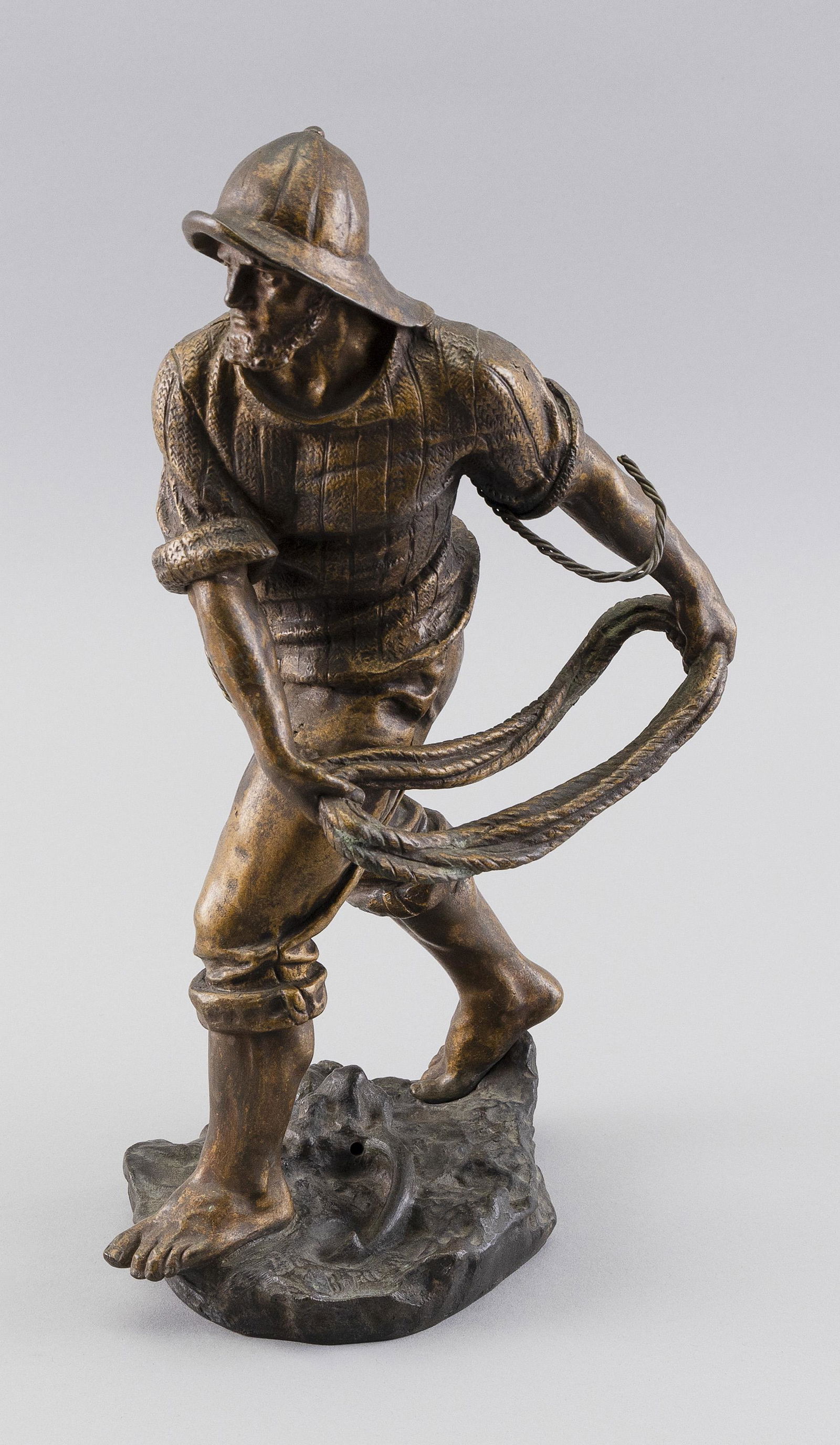 BRONZE SCULPTURE OF AN OLD SALT THROWING A LINE Early 20th Century Height 11.75". (1 of 5)