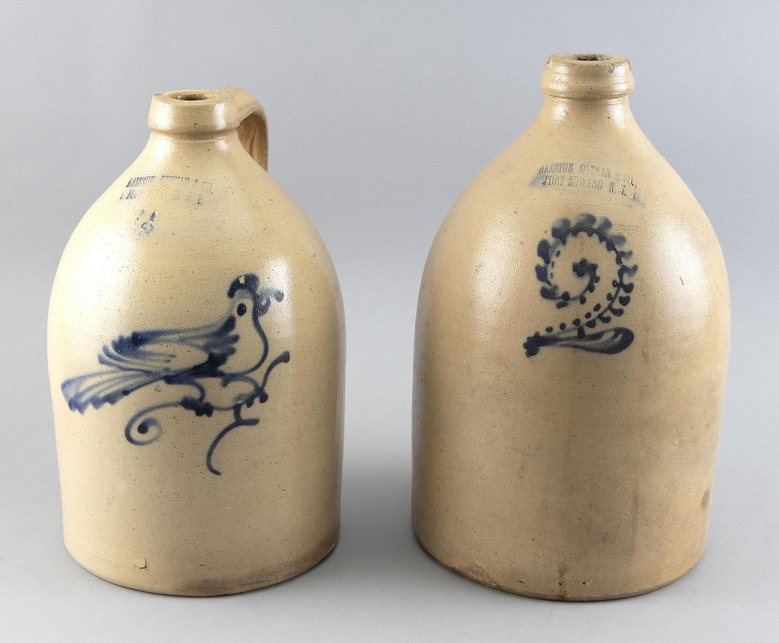 TWO TWO-GALLON STONEWARE JUGS 19th Century Heights 13" and 15". (1 of 2)