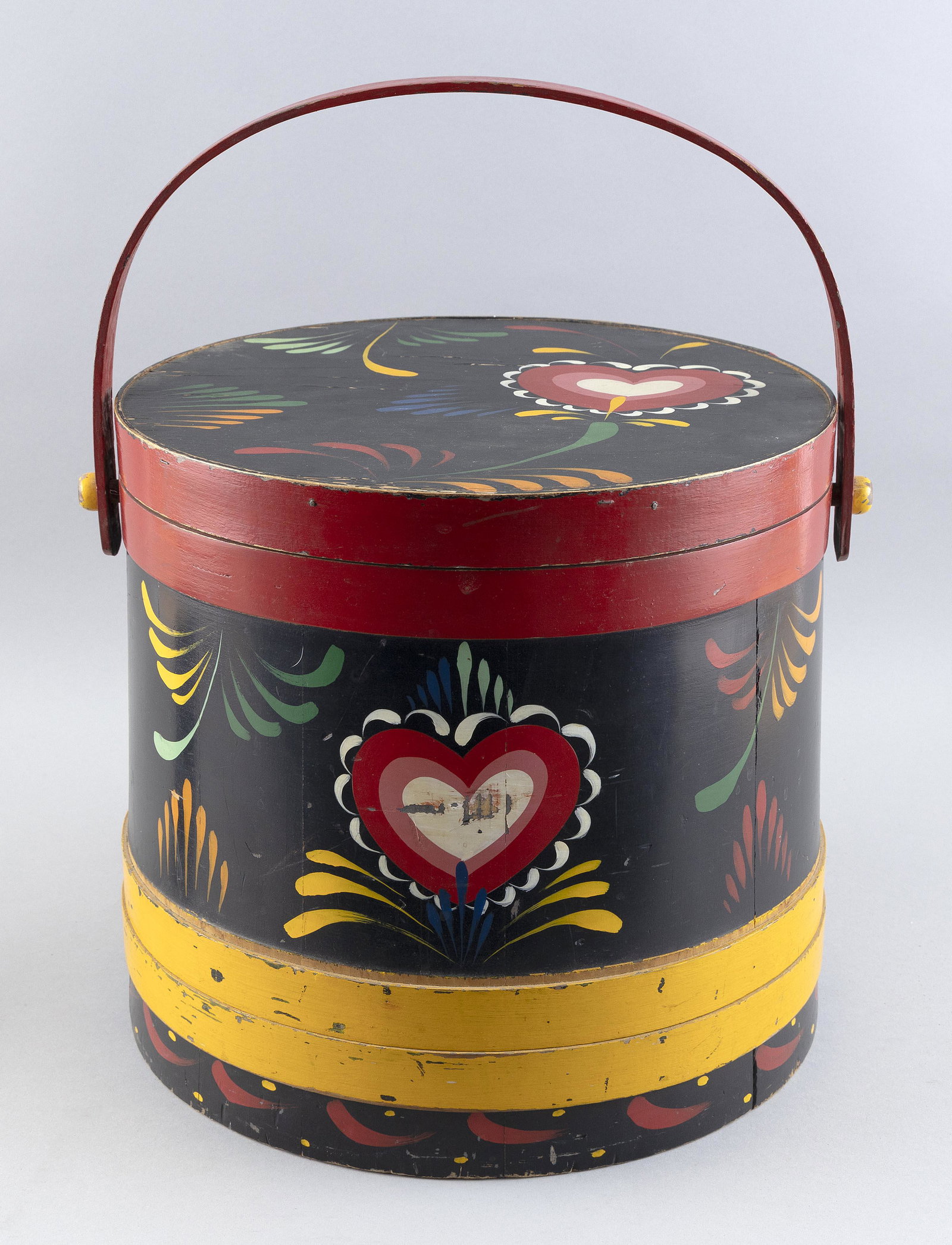 NANCY WHORF (Massachusetts/Florida, 1930-2009), Wood firkin, Height 12". Diameter 12".: NANCY WHORF Massachusetts/Florida, 1930-2009 Wood firkin with painted decoration of colorful hearts and ferns on a black ground. Red bail handle. No signature noted but purchased directly from Peter H