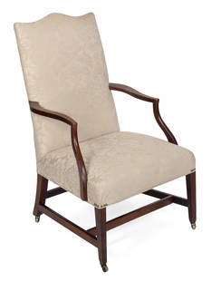 FEDERAL LOLLING CHAIR Circa 1800 Back height 44.5&#8221;. Seat height 18&#8221;.: FEDERAL LOLLING CHAIRCirca 1800In mahogany. Back with shield crest. Tapered legs joined by an H-stretcher and fitted with brass casters. Beige floral print upholstery.Back height 44.5&rdquo;. Seat hei