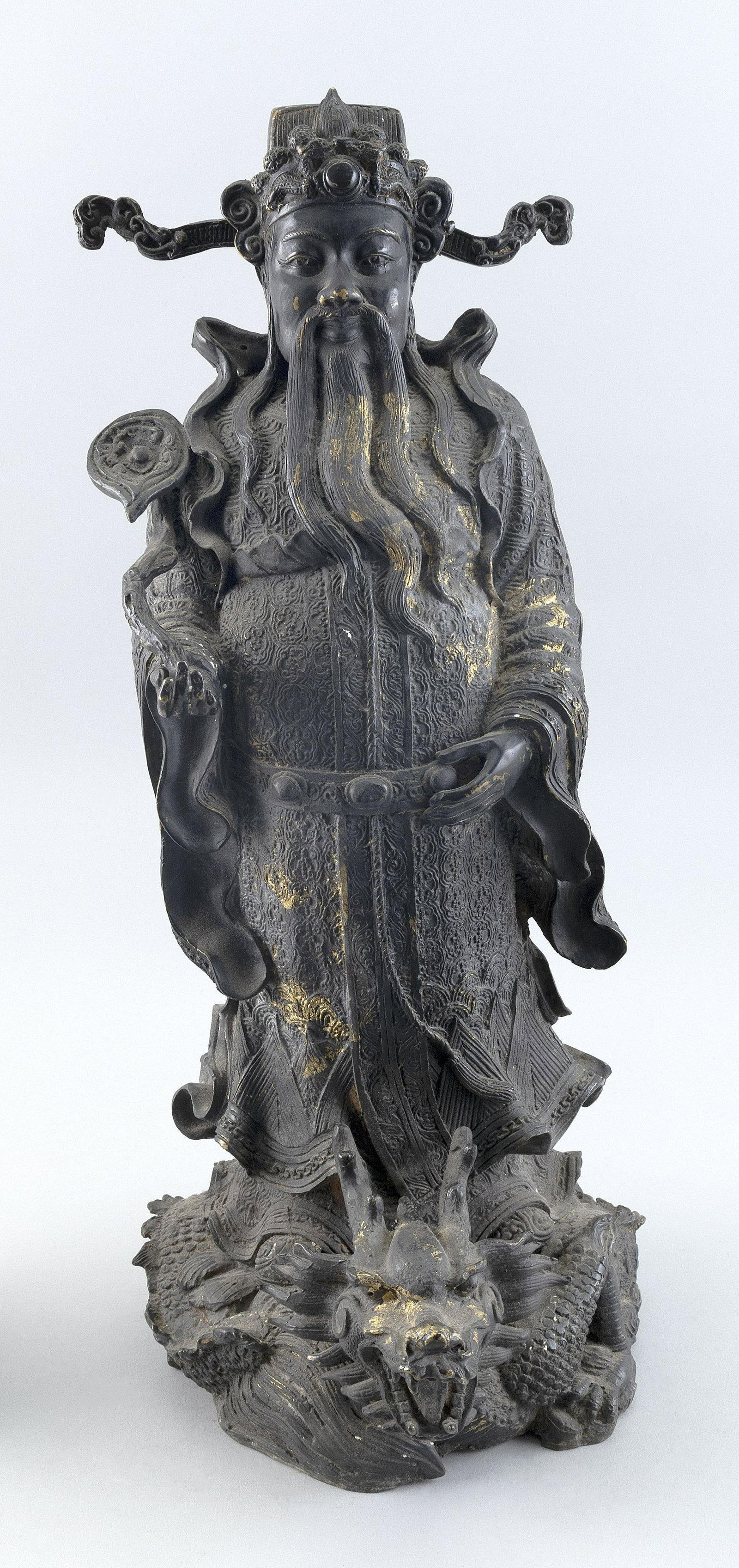 CHINESE BRONZE DEITY 19th Century Height 20".: CHINESE BRONZE DEITY 19th Century Holding a scepter and standing on the back of a dragon. Traces of gilding. Height 20".