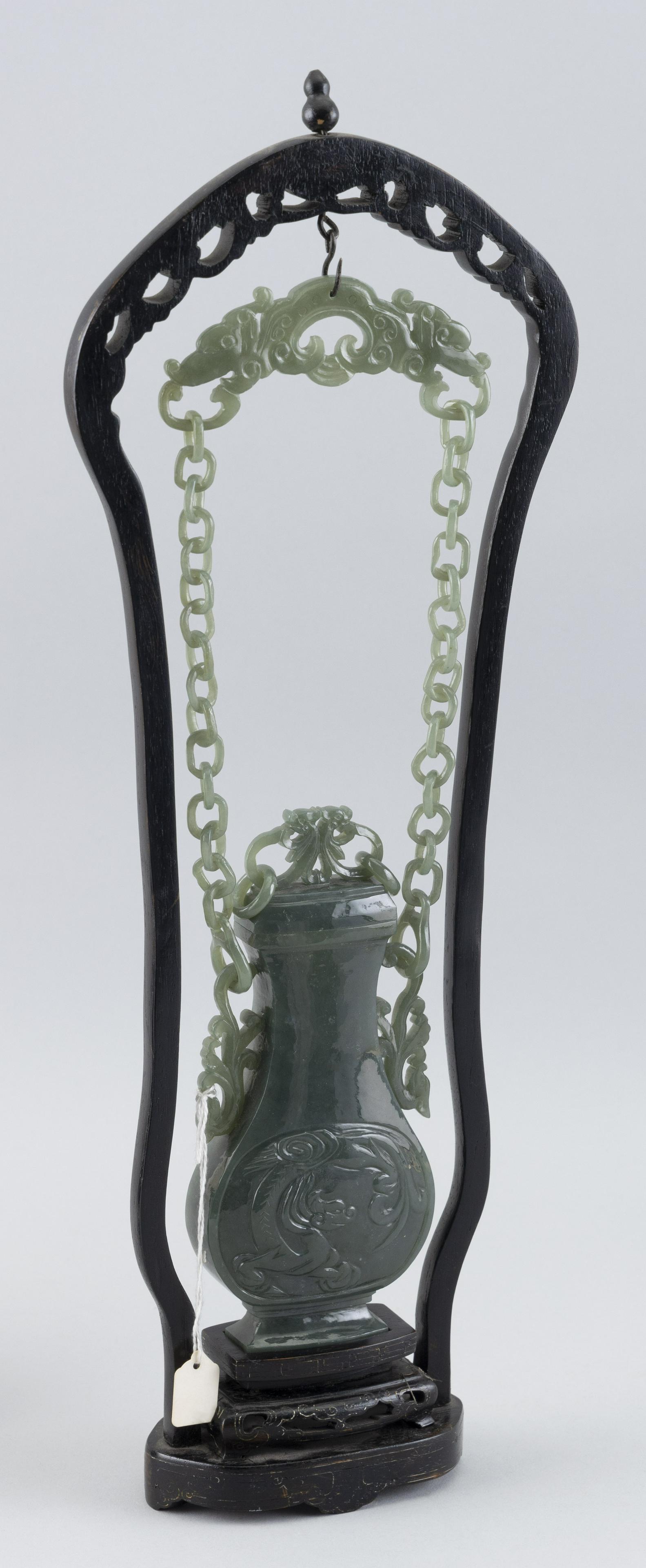 CHINESE GREEN JADE COVERED VASE WITH WOOD STAND Vase height 7". Stand height 17.5”. (1 of 2)