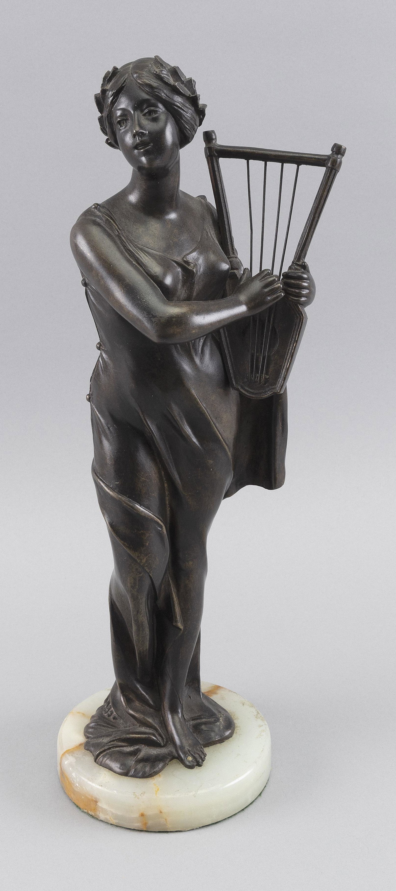 BRONZE FIGURE OF A WOMAN WITH A HARP 20th Century Height including base 17".: BRONZE FIGURE OF A WOMAN WITH A HARP 20th Century White marble base. Unsigned. Height including base 17".