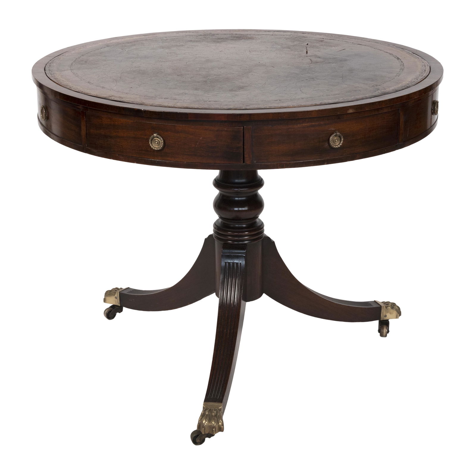 DUNCAN PHYFE-STYLE DRUM TABLE Early 20th Century Height 29”. Diameter of top 36”.: DUNCAN PHYFE-STYLE DRUM TABLEEarly 20th CenturyWith inset leather top, four drawers in apron, turned pedestal base and brass paw feet fitted with castors.Height 29”. Diameter of top 36”.