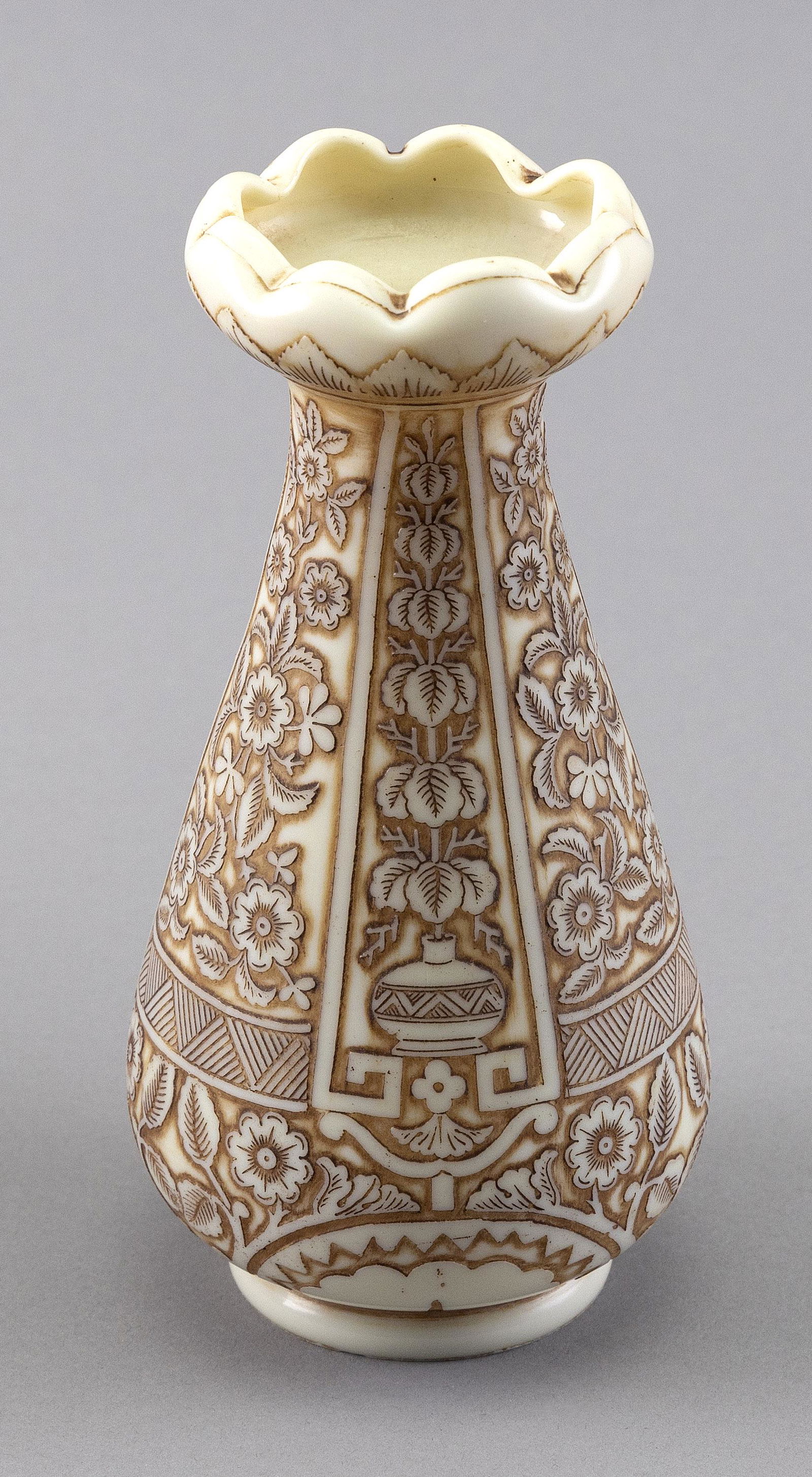 THOMAS WEBB & SONS "IVORY" CAMEO GLASS VASE Late 19th Century Height 6".: THOMAS WEBB & SONS "IVORY" CAMEO GLASS VASELate 19th CenturyTapered body with garlic-form mouth. Floral and foliate design emulates carved ivory. Signed on base.Height 6".
