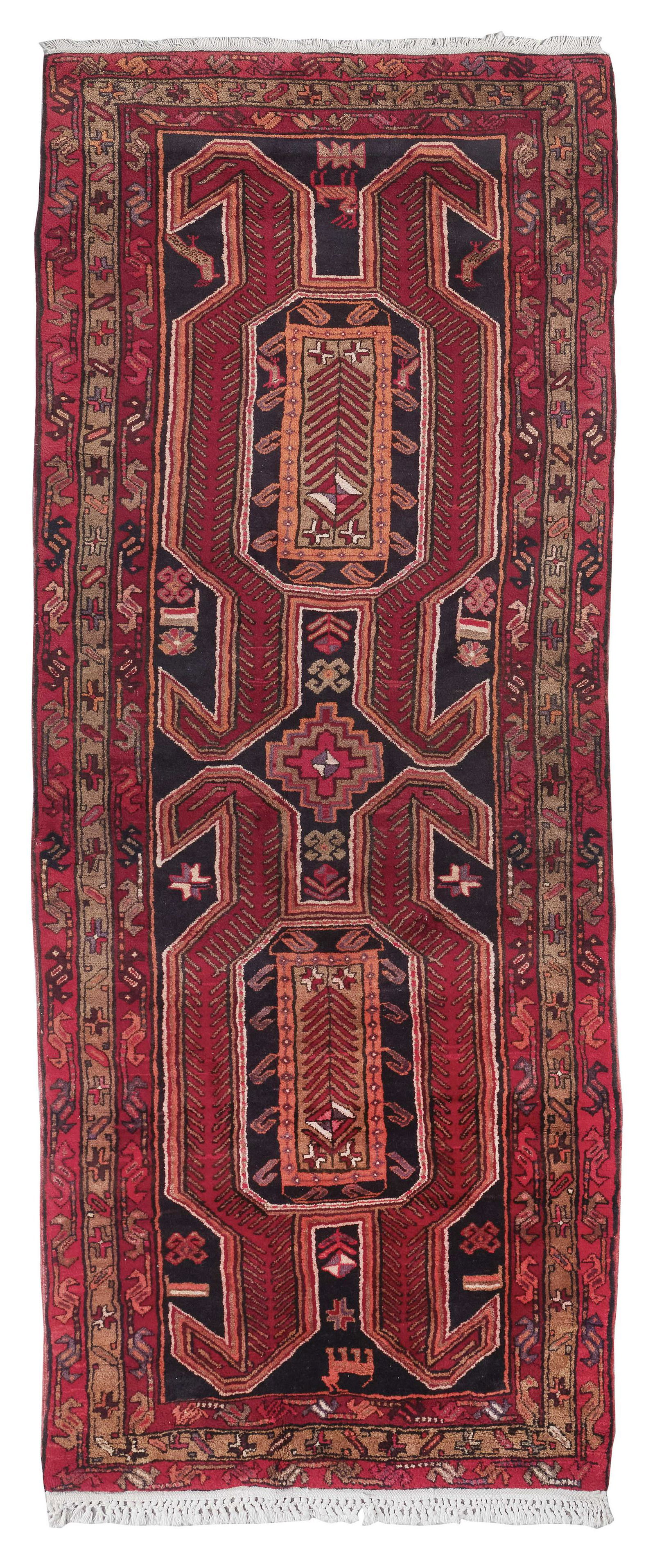 NORTHWEST PERSIAN RUG: 4’4” X 10’10” 20th/21st Century: NORTHWEST PERSIAN RUG: 4’4” X 10’10” 20th/21st Century Two bold deep crimson, dark orange, khaki, charcoal and ivory stylized elements fill a dark charcoal field. Three red and