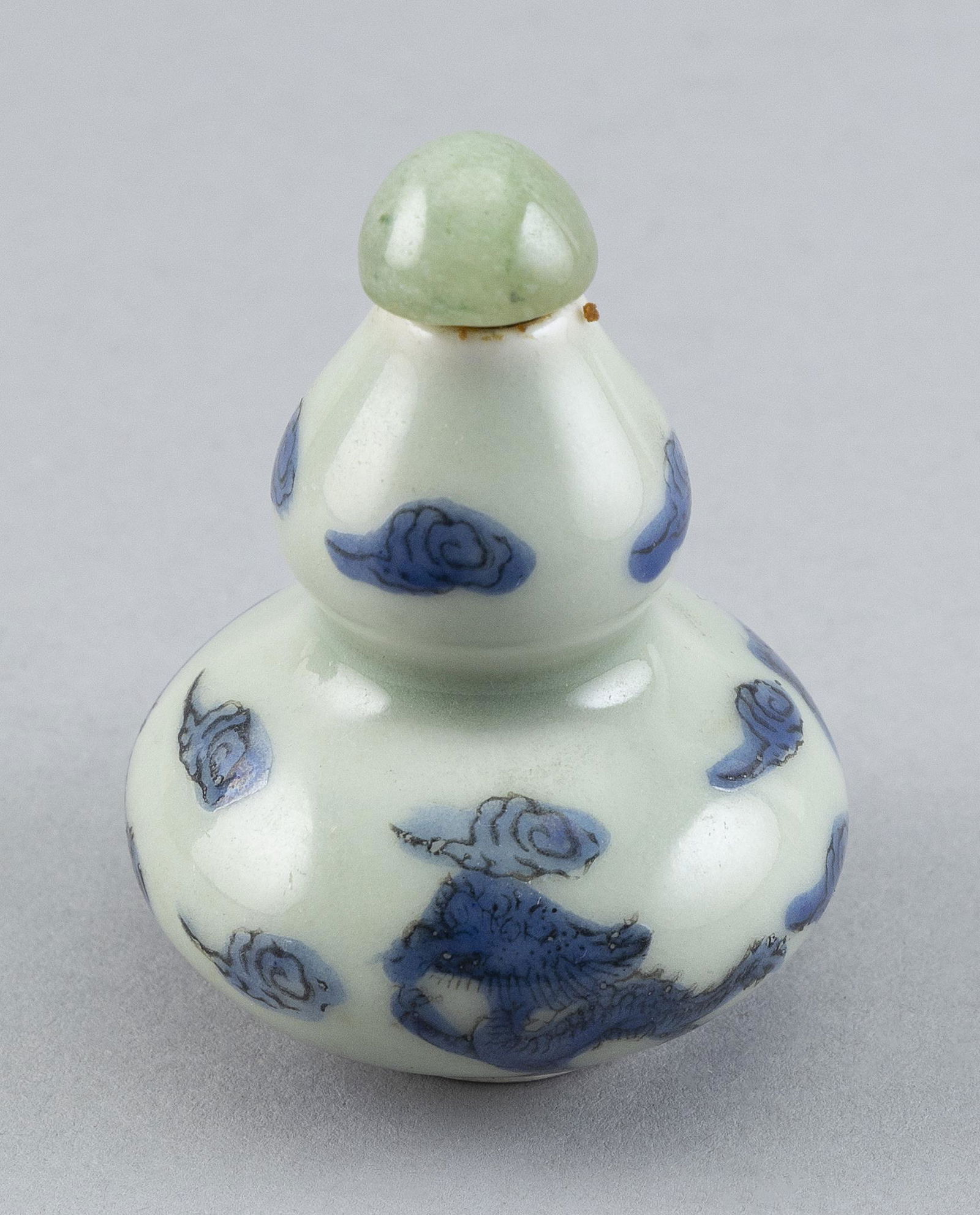 CHINESE BLUE-ON-CELADON PORCELAIN SNUFF BOTTLE Early 20th Century Height 2.5". (1 of 2)
