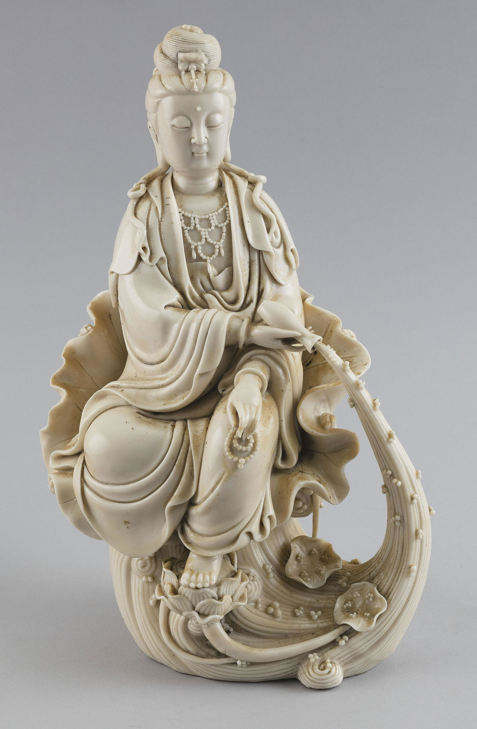 CHINESE BLANC DE CHINE PORCELAIN FIGURE OF GUANYIN 20th Century Height 12”. (1 of 2)