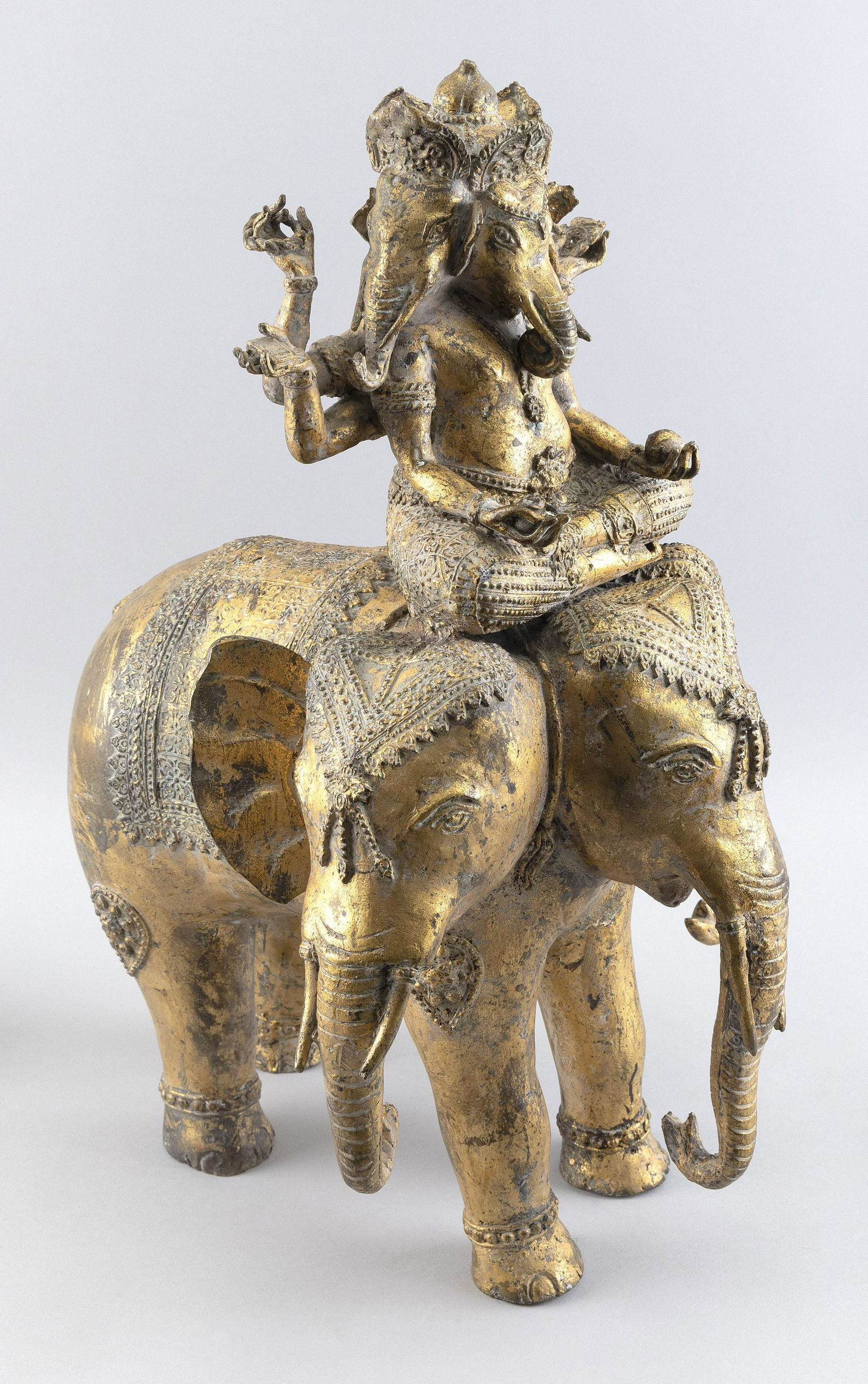 NEPALESE GILT-BRONZE FIGURE OF GANESHA RIDING AN ELEPHANT 20th Century Height 19”. Length (1 of 3)