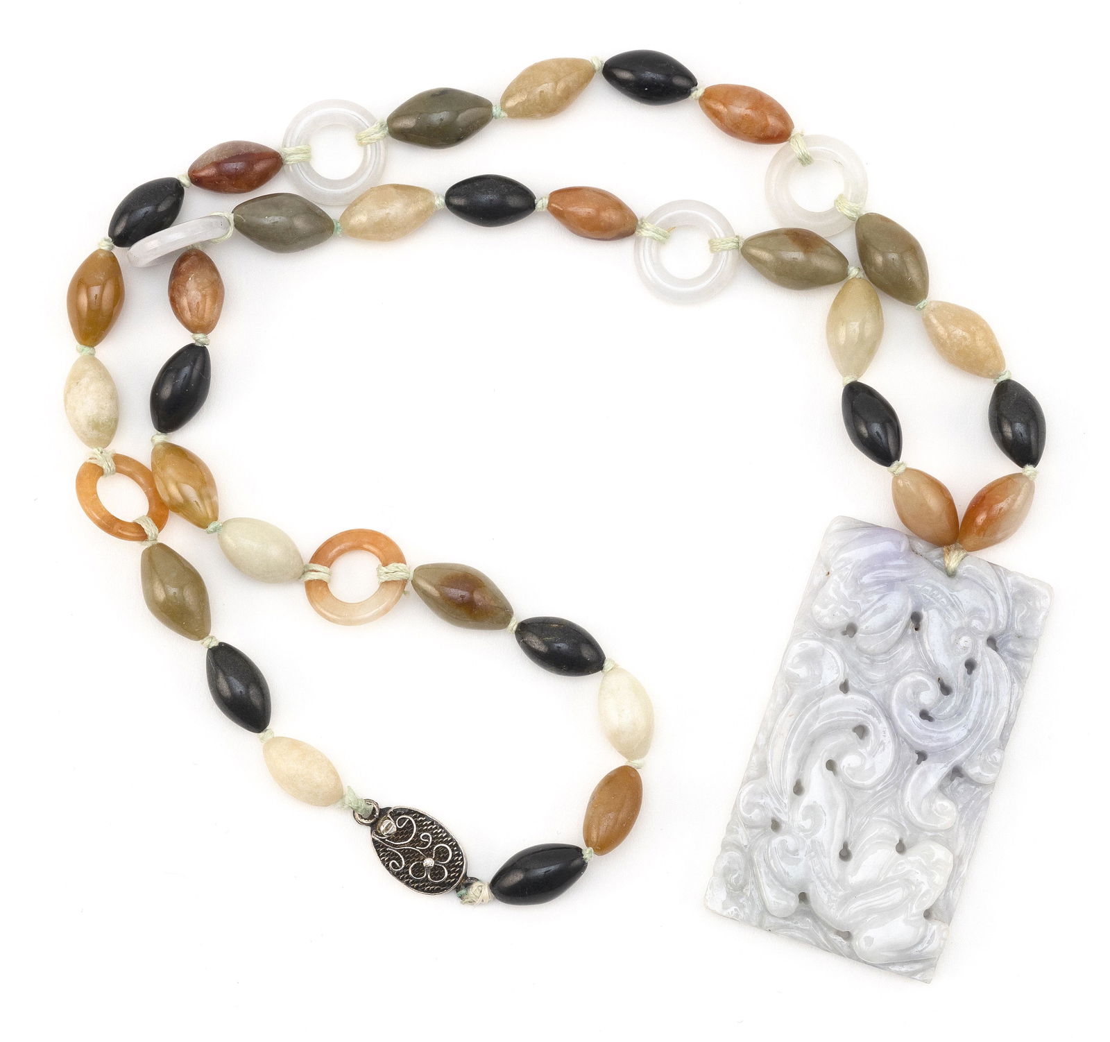 CHINESE CARVED LIGHT CELADON JADE PENDANT ON NECKLACE 20th Century Pendant 2.5" x 1.25". Necklace: CHINESE CARVED LIGHT CELADON JADE PENDANT ON NECKLACE20th CenturyPendant with raised ruyi decoration. Necklace comprised of 32 15.0mm multicolored jade seed-form beads and six 13.0mm ring spacers. Mar