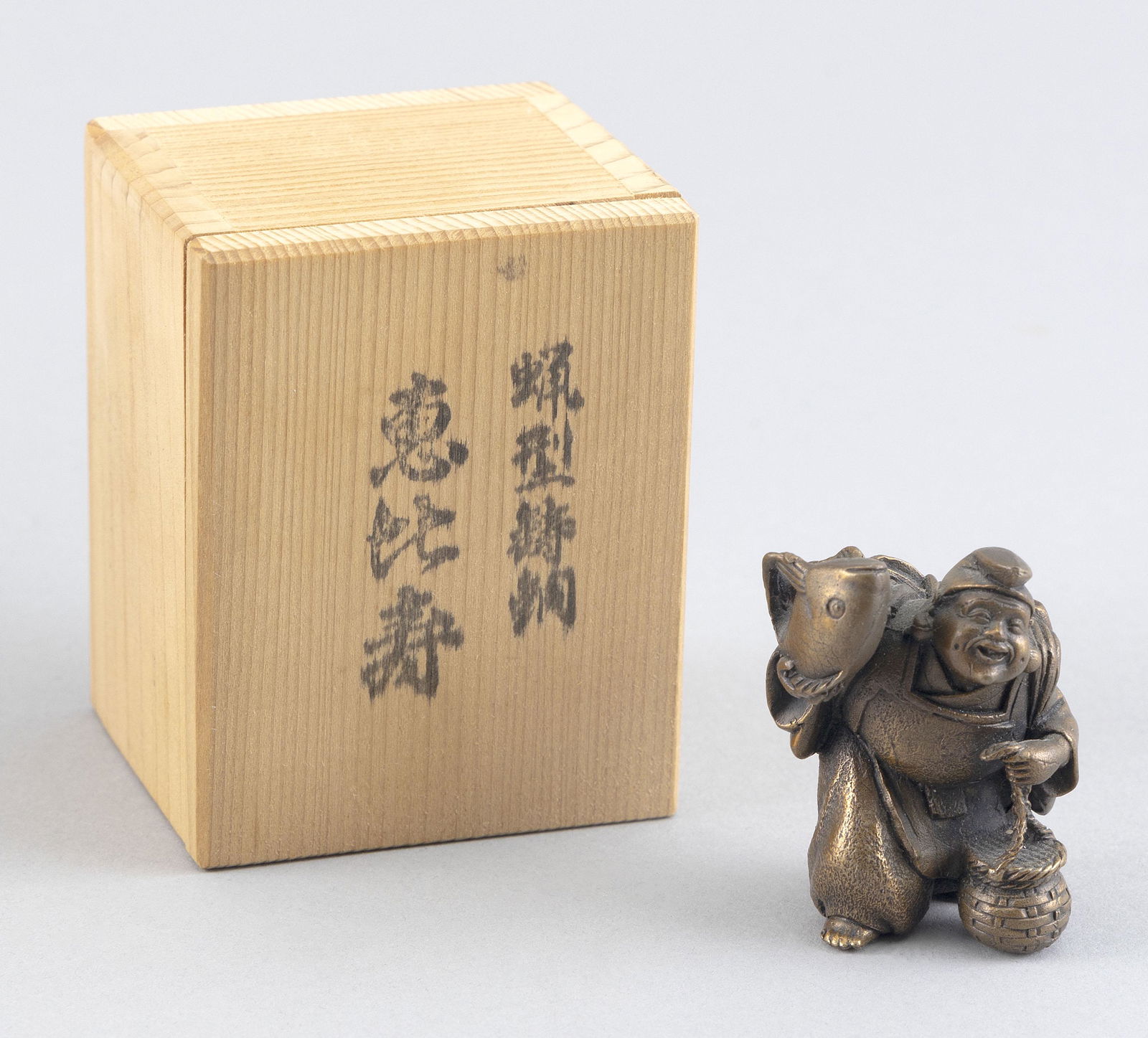 JAPANESE BRONZE OKIMONO OF EBISU 20th Century Okimono height 2". With original signed kiriwood box. (1 of 2)