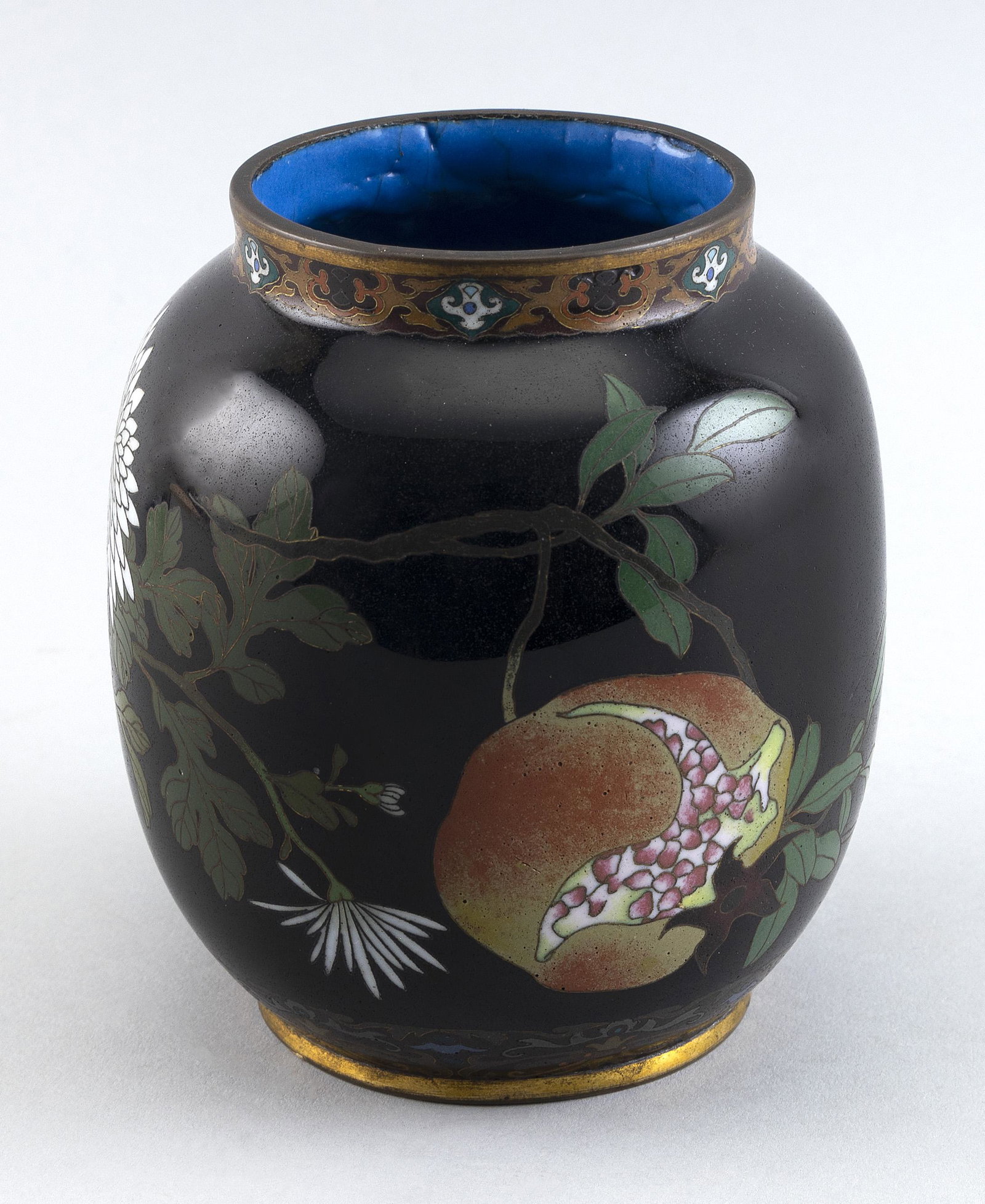 JAPANESE CLOISONNÉ ENAMEL JAR Meiji Period Height 5.25”.: JAPANESE CLOISONNÉ ENAMEL JAR Meiji Period In ovoid form with decoration of pomegranate, chrysanthemum and iris against a midnight blue ground. No marks noted. Height 5.25”.