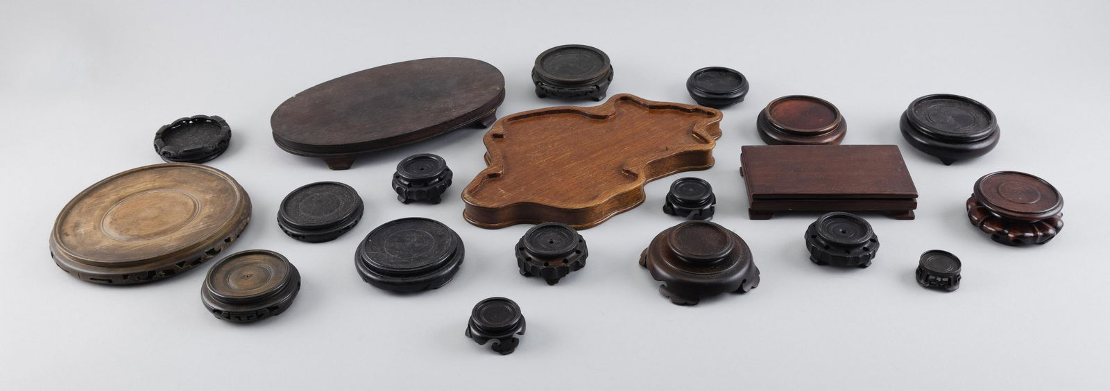 APPROX. TWENTY ASSORTED CHINESE WOOD STANDS 19th/20th Century Lengths from 2" to 11". (1 of 1)