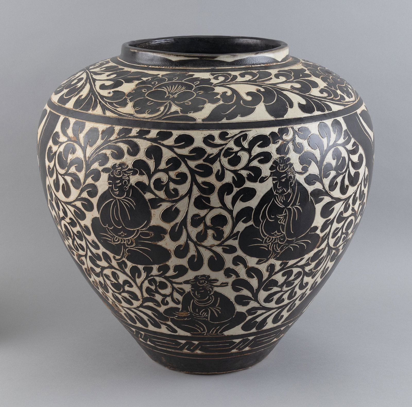 CHINESE SGRAFFITO BROWN AND WHITE PORCELAIN OVOID JAR Late 19th Century Height 16”.: CHINESE SGRAFFITO BROWN AND WHITE PORCELAIN OVOID JAR Late 19th Century Lotus and seated Buddha decoration. Height 16”.