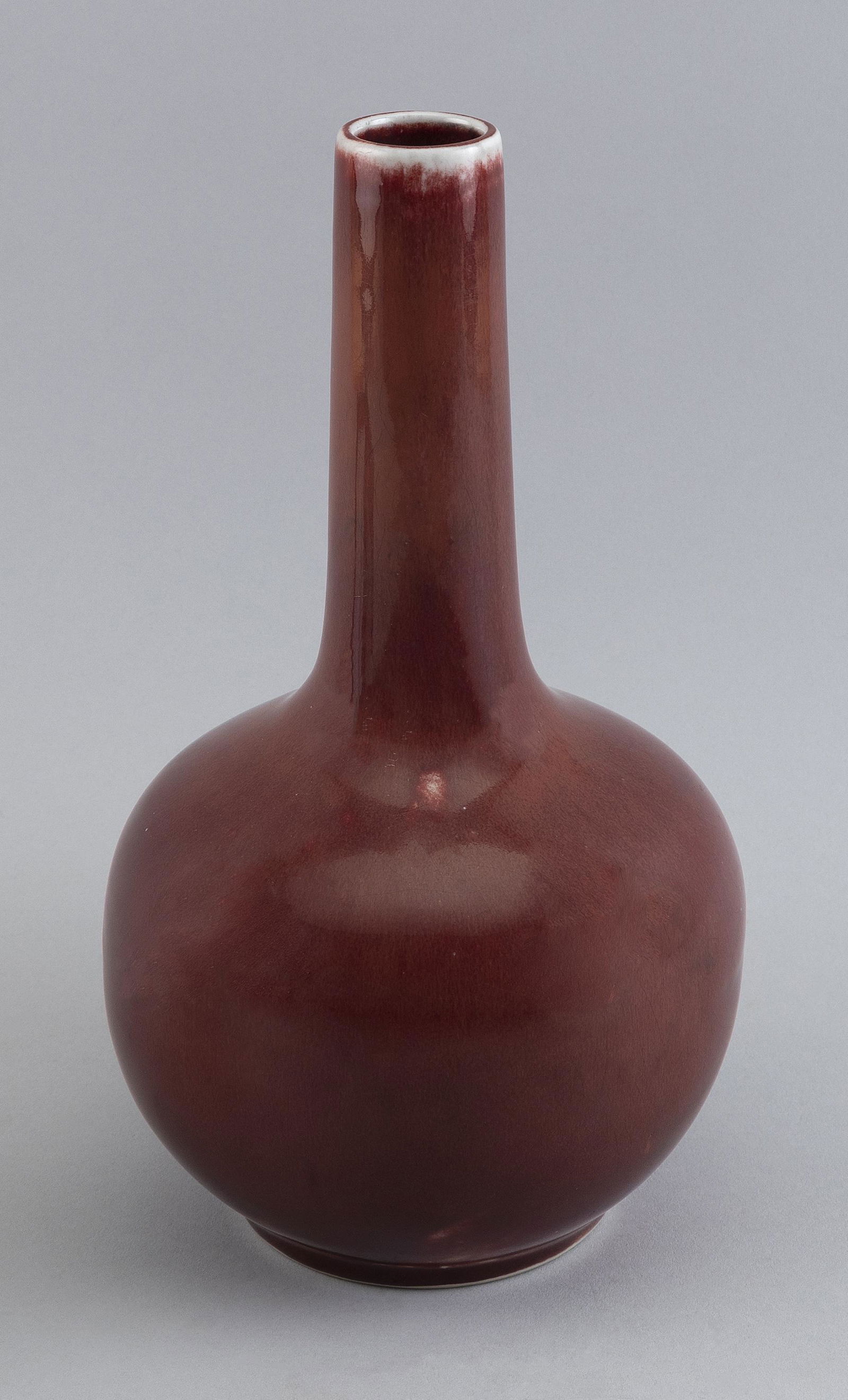 CHINESE SANG DE BOEUF PORCELAIN BOTTLE VASE Late 19th/Early 20th Century Height 10.5”. (1 of 7)
