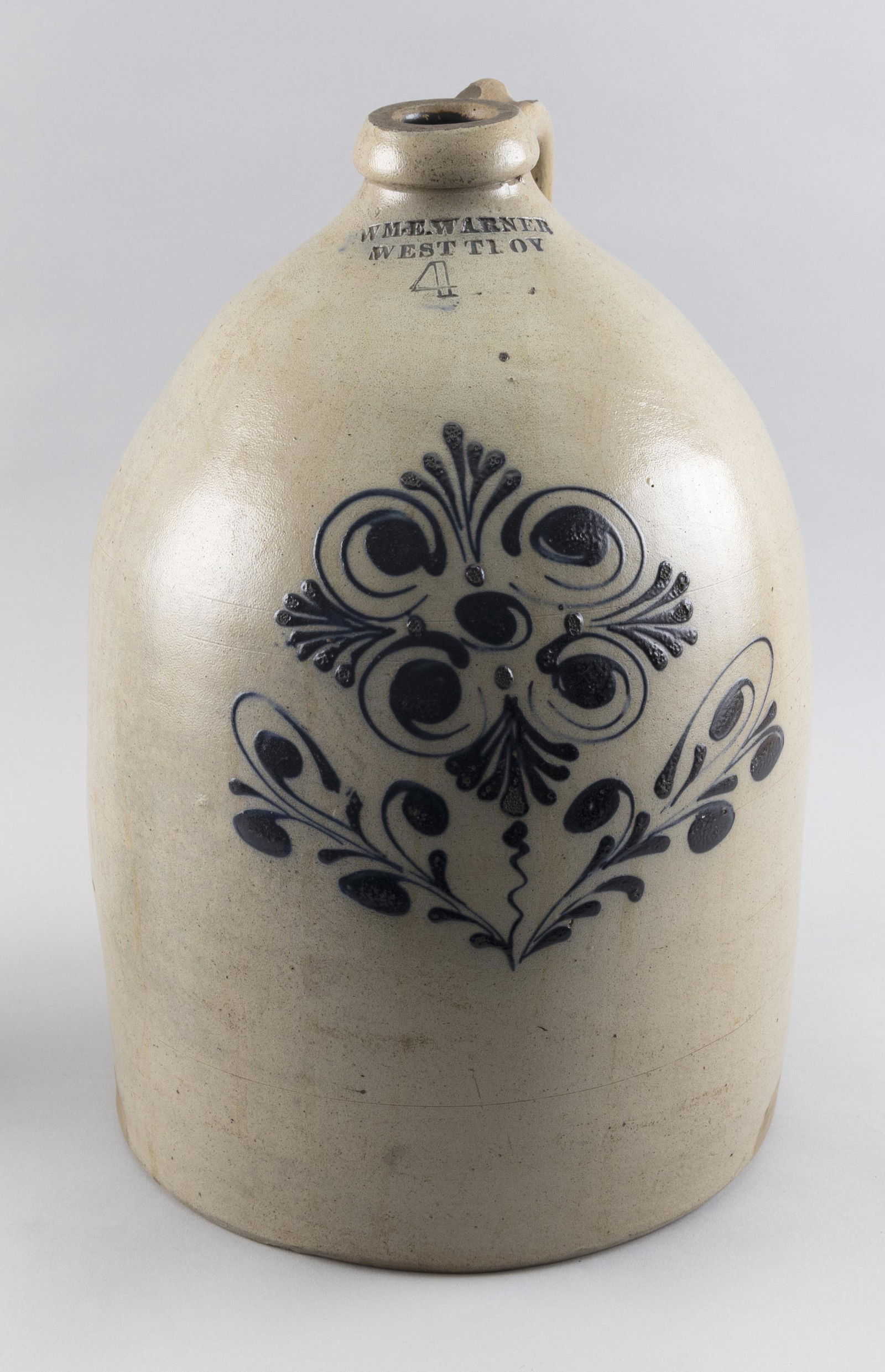 WM. E. WARNER FOUR-GALLON STONEWARE JUG West Troy, New York, Circa 1850 Height 16". (1 of 2)