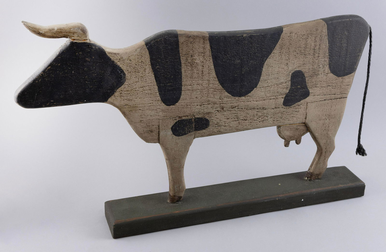 CARVED AND PAINTED WOODEN COW SILHOUETTE Late 20th Century Height 17”. Length 28”. (1 of 2)