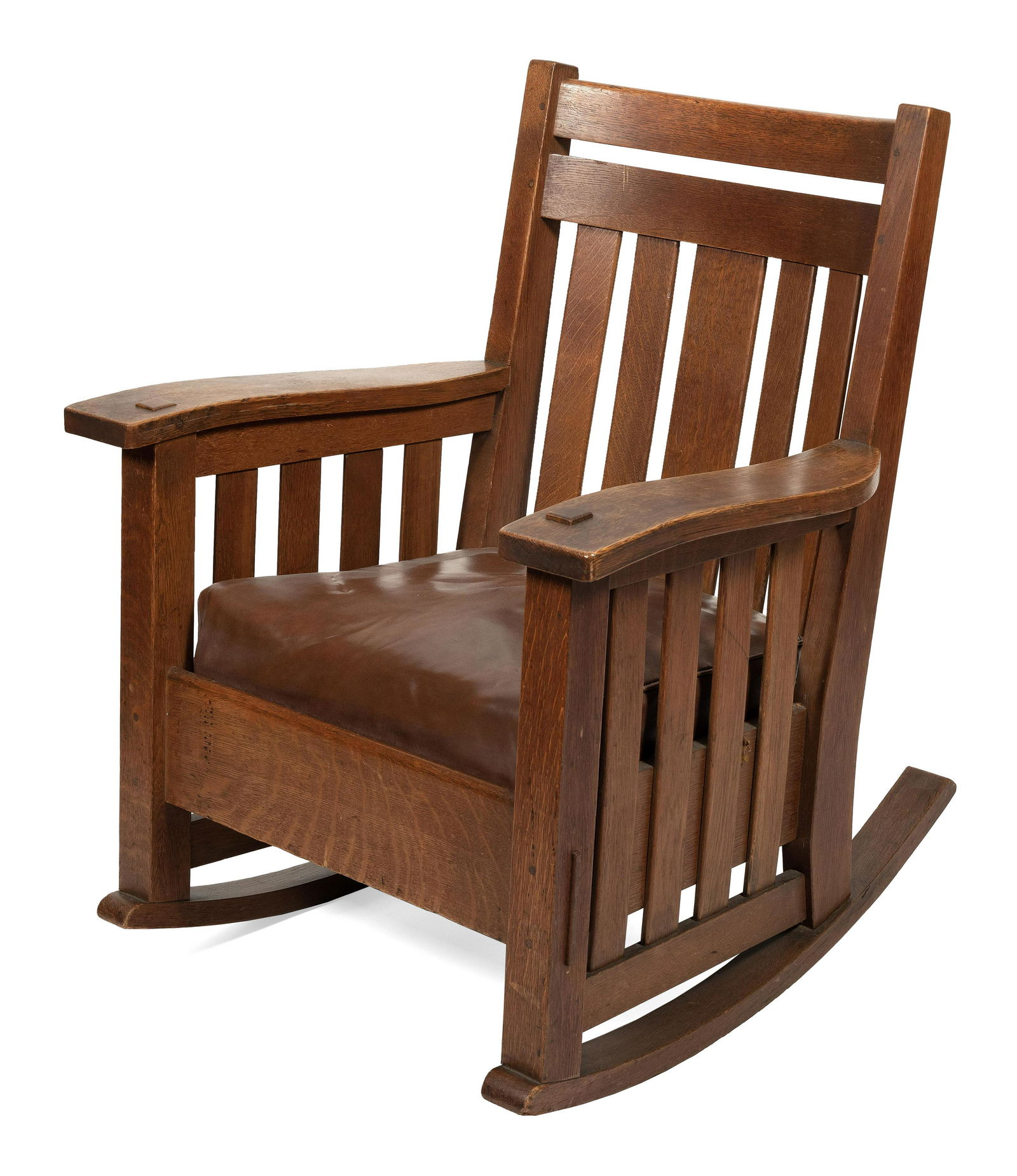 HARDEN MISSION OAK “WAVEY ARM” ROCKING CHAIR Early 20th Century Height 35”. Width: HARDEN MISSION OAK â€œWAVEY ARM” ROCKING CHAIREarly 20th CenturyWith slatted sides and back. Original paper label.Height 35”. Width 29.75”. Depth 30”.