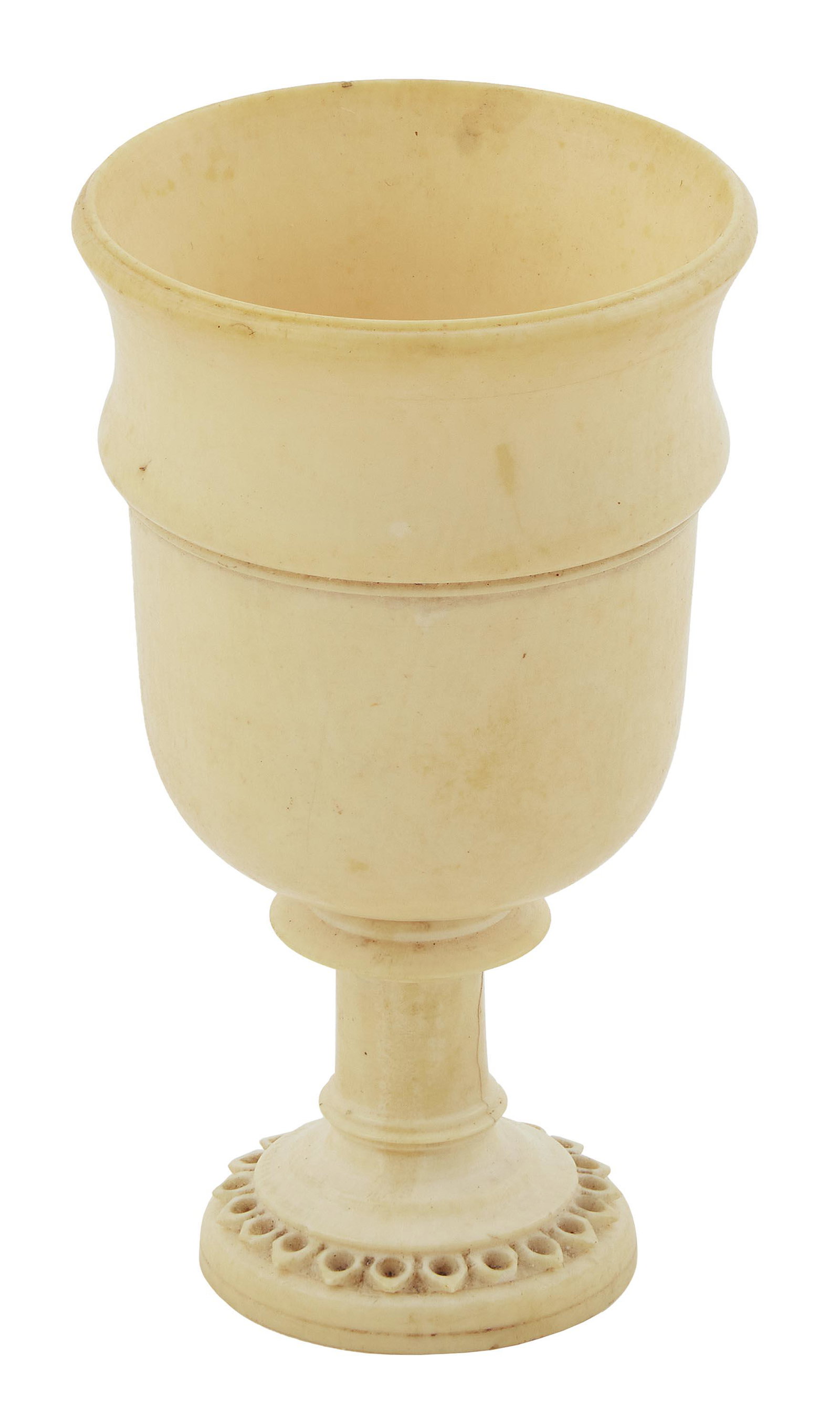 IVORY CORDIAL CUP 19th Century Height 2.75". Diameter 1.5".: IVORY CORDIAL CUP 19th Century Elegantly turned. Carved acanthus leaf design on foot. Height 2.75";. Diameter 1.5";. Provenance: The Collection of Chuck and Jan Deluca.
