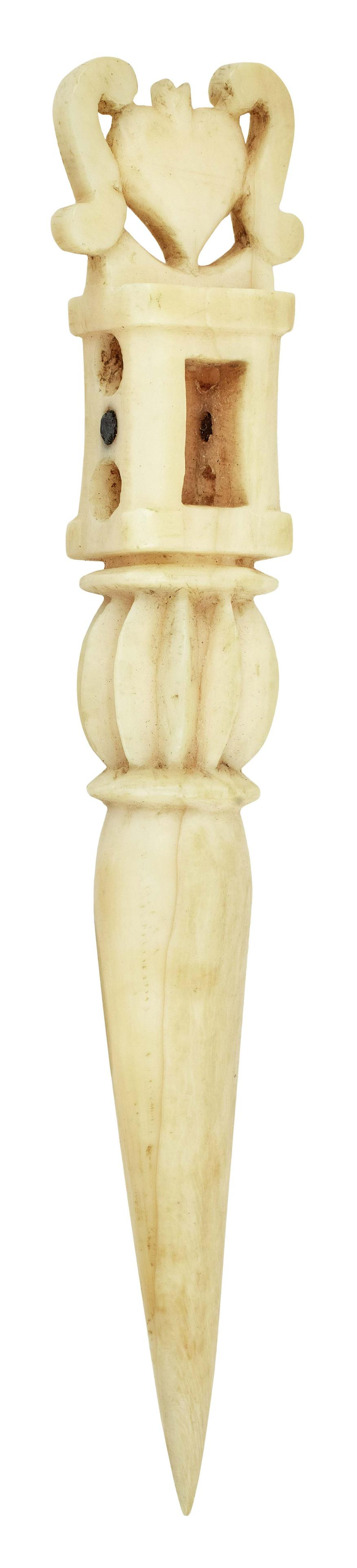 CARVED WHALE IVORY BODKIN 19th Century Length 4.25".: CARVED WHALE IVORY BODKIN 19th Century Upper portion carved as a bracketed heart, an open section and a fluted ball. Open section inlaid with a contrasting dot on both side panels. Length 4.25";. Prov