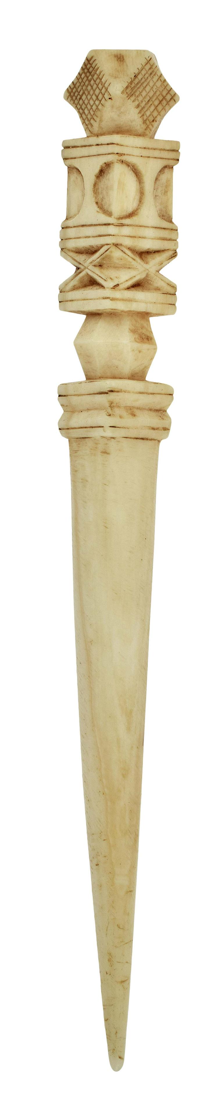 WHALE IVORY BODKIN WITH ARCHITECTURAL CARVINGS 19th Century Length 3.5".: WHALE IVORY BODKIN WITH ARCHITECTURAL CARVINGS 19th Century Faceted finial with incised crosshatching. Terminal with circle-in-square, X, polyhedral and stepped carvings. Length 3.5";. Provenance: The