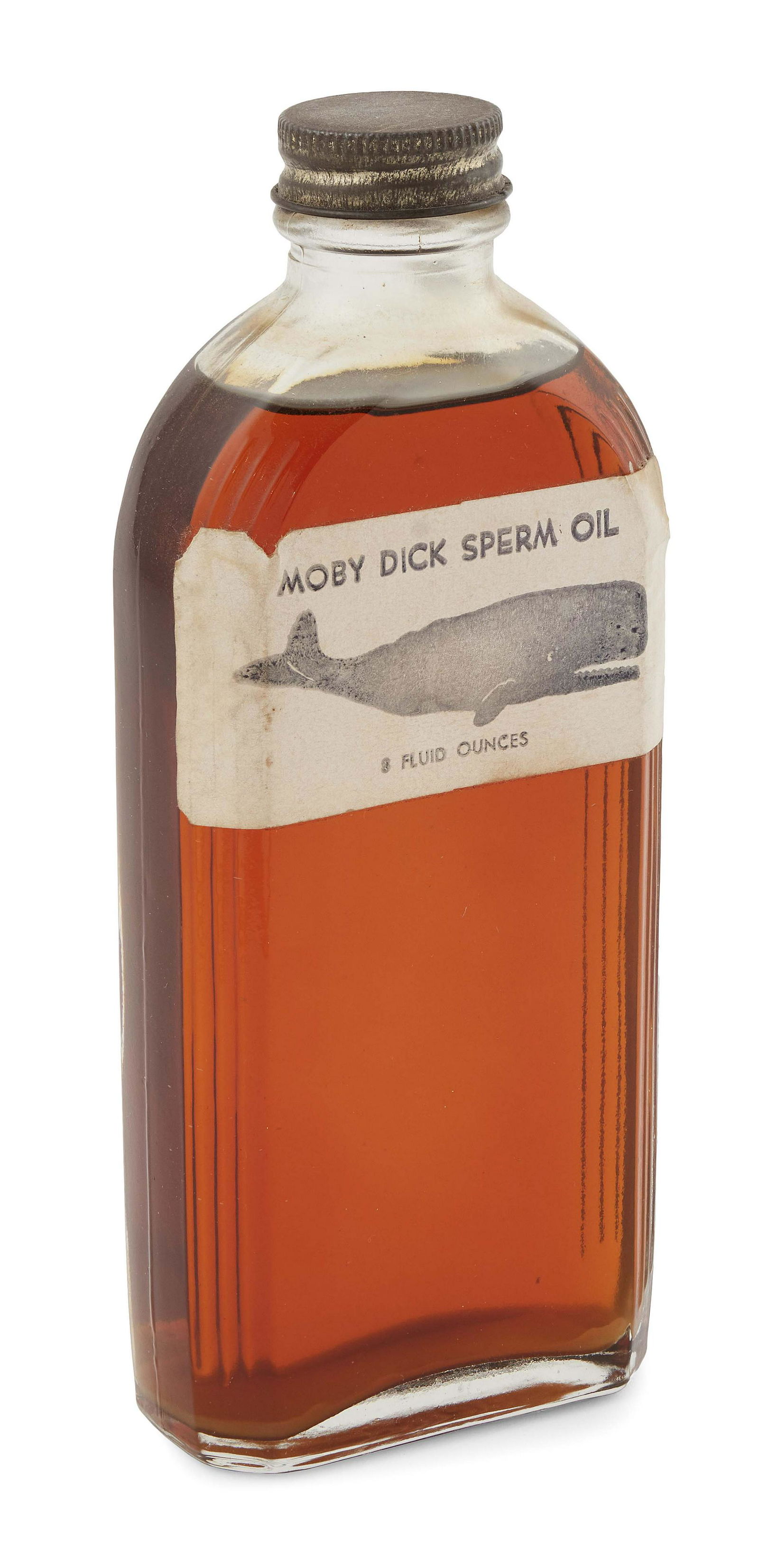RARE BOTTLE OF "MOBY DICK SPERM OIL" Late 19th/Early 20th Century Height 7".: RARE BOTTLE OF ";MOBY DICK SPERM OIL";Late 19th/Early 20th CenturyOriginal paper label depicts a sperm whale. Contains eight fluid ounces. Unopened.Height 7";. Provenance:Nina Hellman Antiques, Nantuc