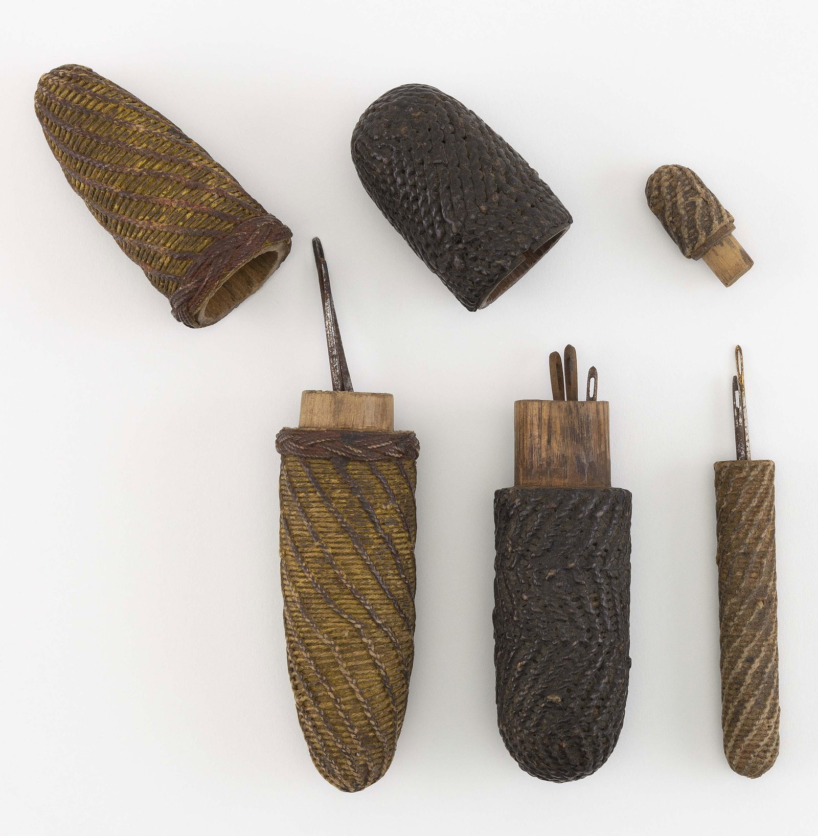 THREE SAILOR'S ROPEWORK NEEDLE CASES 19th Century Lengths from 5" to 7.5".: THREE SAILOR'S ROPEWORK NEEDLE CASES19th CenturyLengths from 5" to 7.5". Provenance:The Collection of Chuck and Jan Deluca.