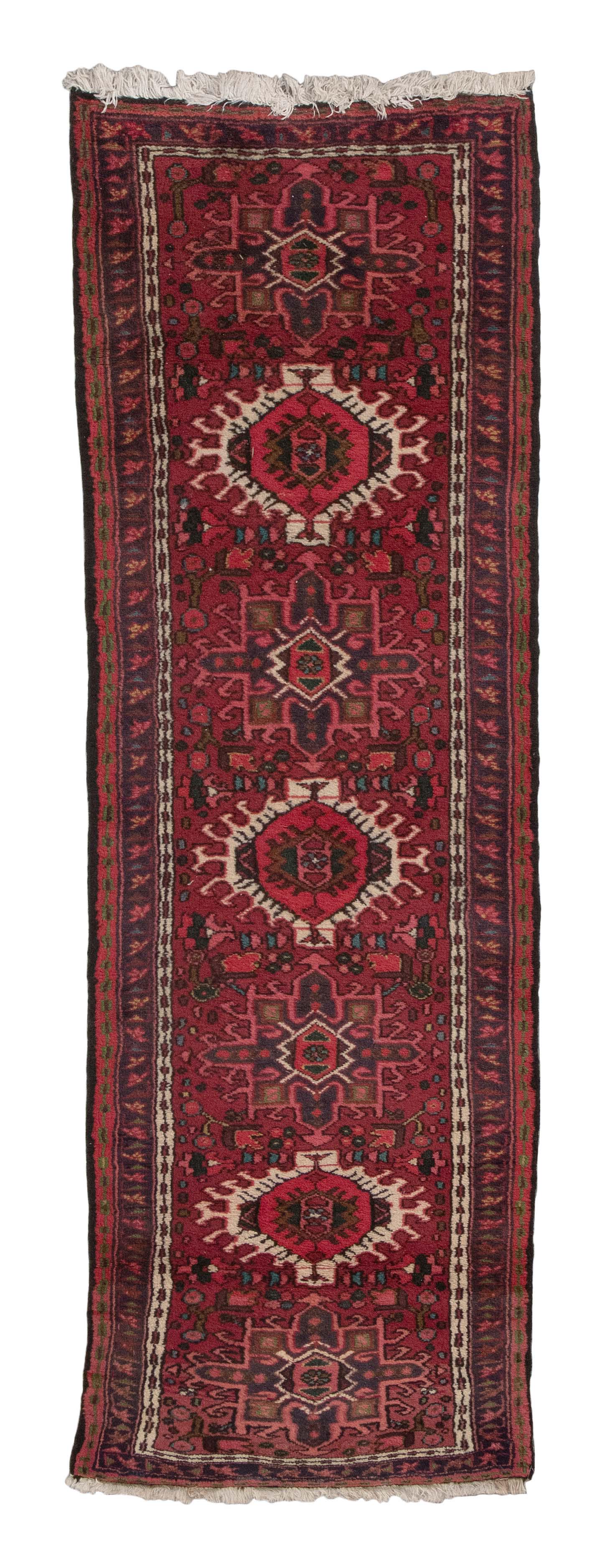 KARAJA RUNNER: 2’1" X 5’5” 20th or 21st Century: KARAJA RUNNER: 2’1" X 5’5” 20th or 21st Century Red, pink, ivory and blue gabled and geometric medallions contain and are surrounded by a variety of stylized elements in colors 