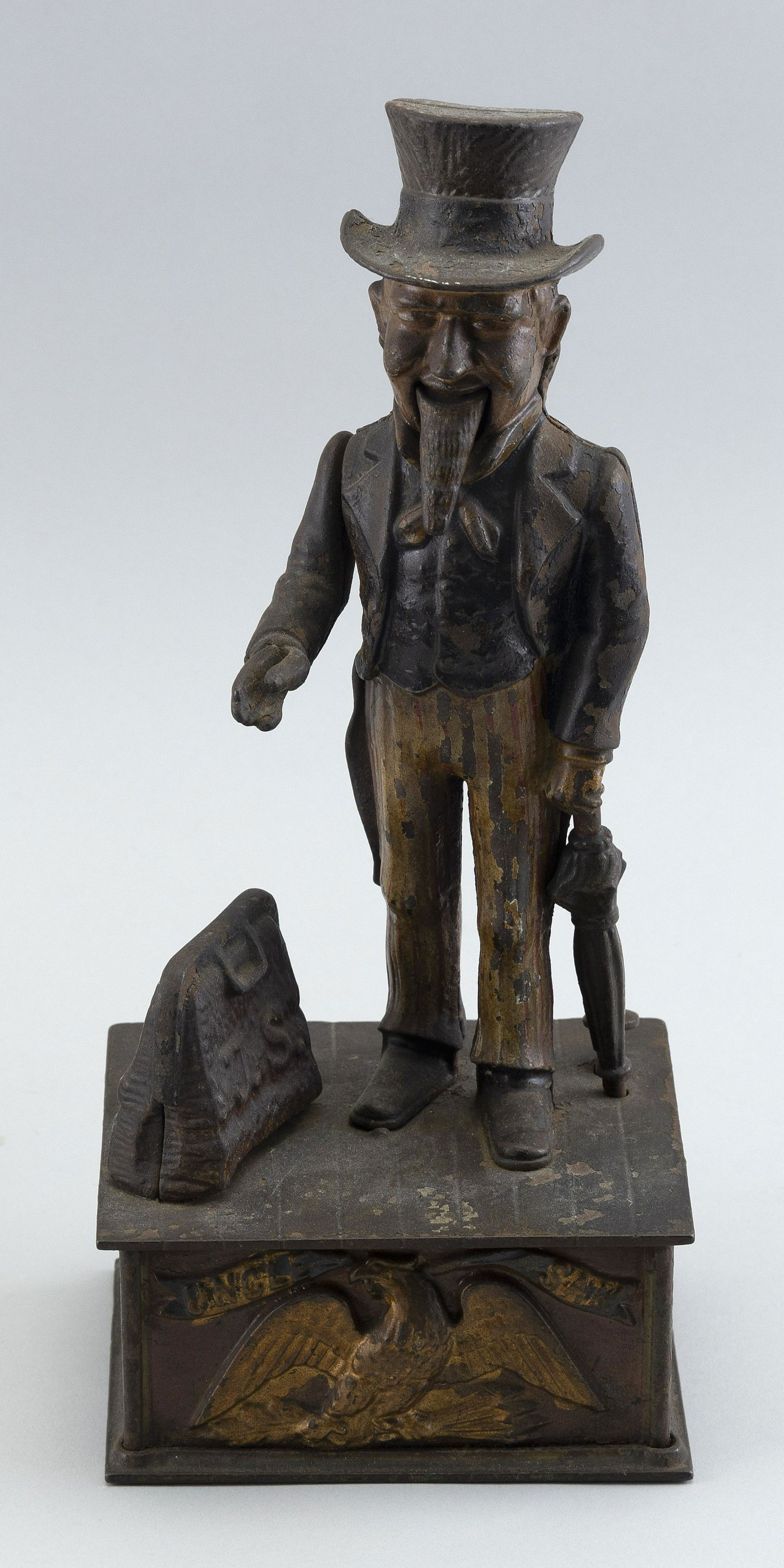 CAST IRON UNCLE SAM MECHANICAL BANK Late 19th Century Height 11.25”. Width 4.75”. Depth (1 of 3)