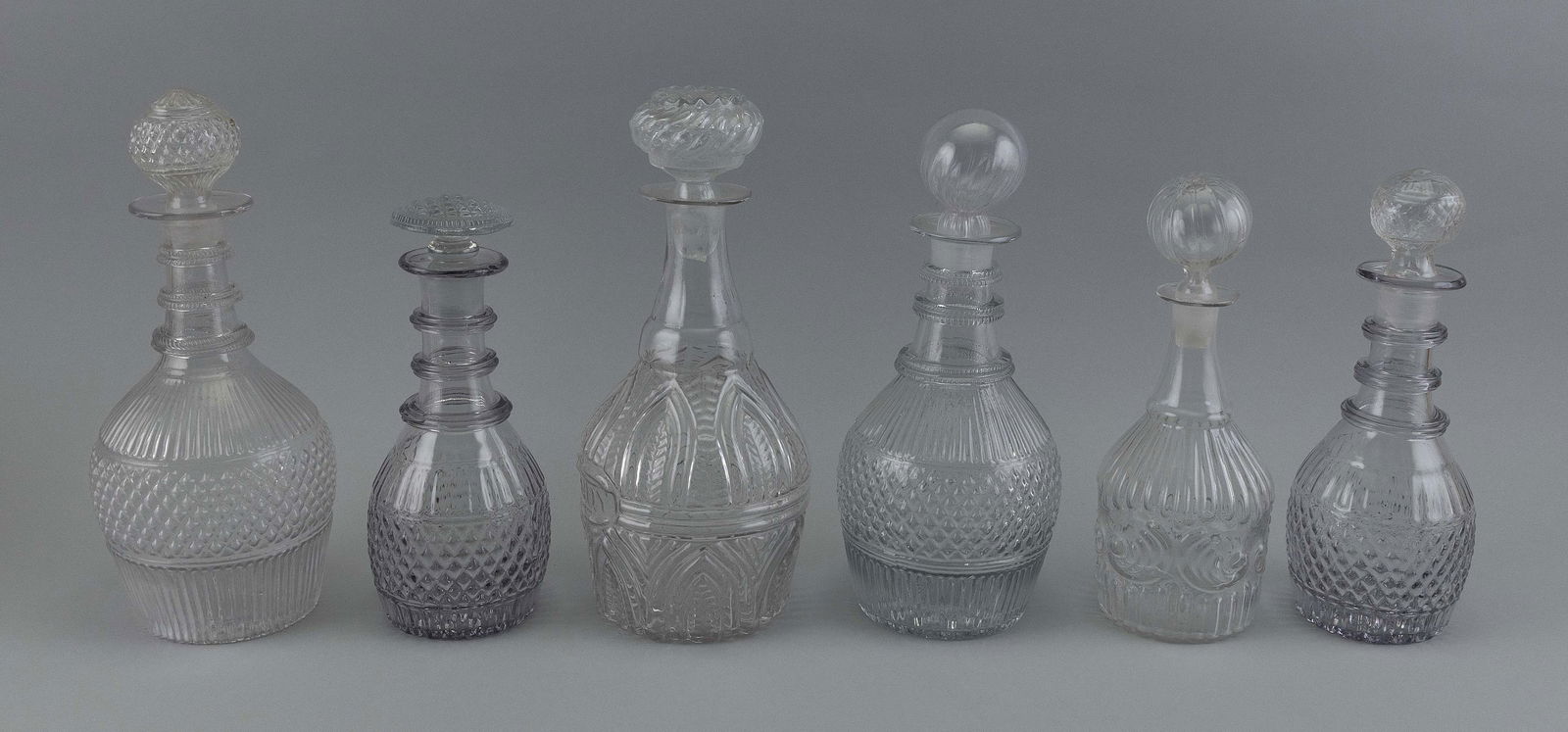 SIX THREE-MOLD CLEAR BLOWN GLASS DECANTERS 19th Century Heights from 8.75” to 10.75”. (1 of 1)