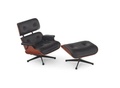 CHARLES AND RAY EAMES MINIATURE LOUNGE CHAIR AND OTTOMAN FOR VITRA DESIGN MUSEUM 1956 Height 5.5".: CHARLES AND RAY EAMES MINIATURE LOUNGE CHAIR AND OTTOMAN FOR VITRA DESIGN MUSEUM 1956 No. 670 and 671. With original crate and brochure. Height 5.5". Length 5.5".