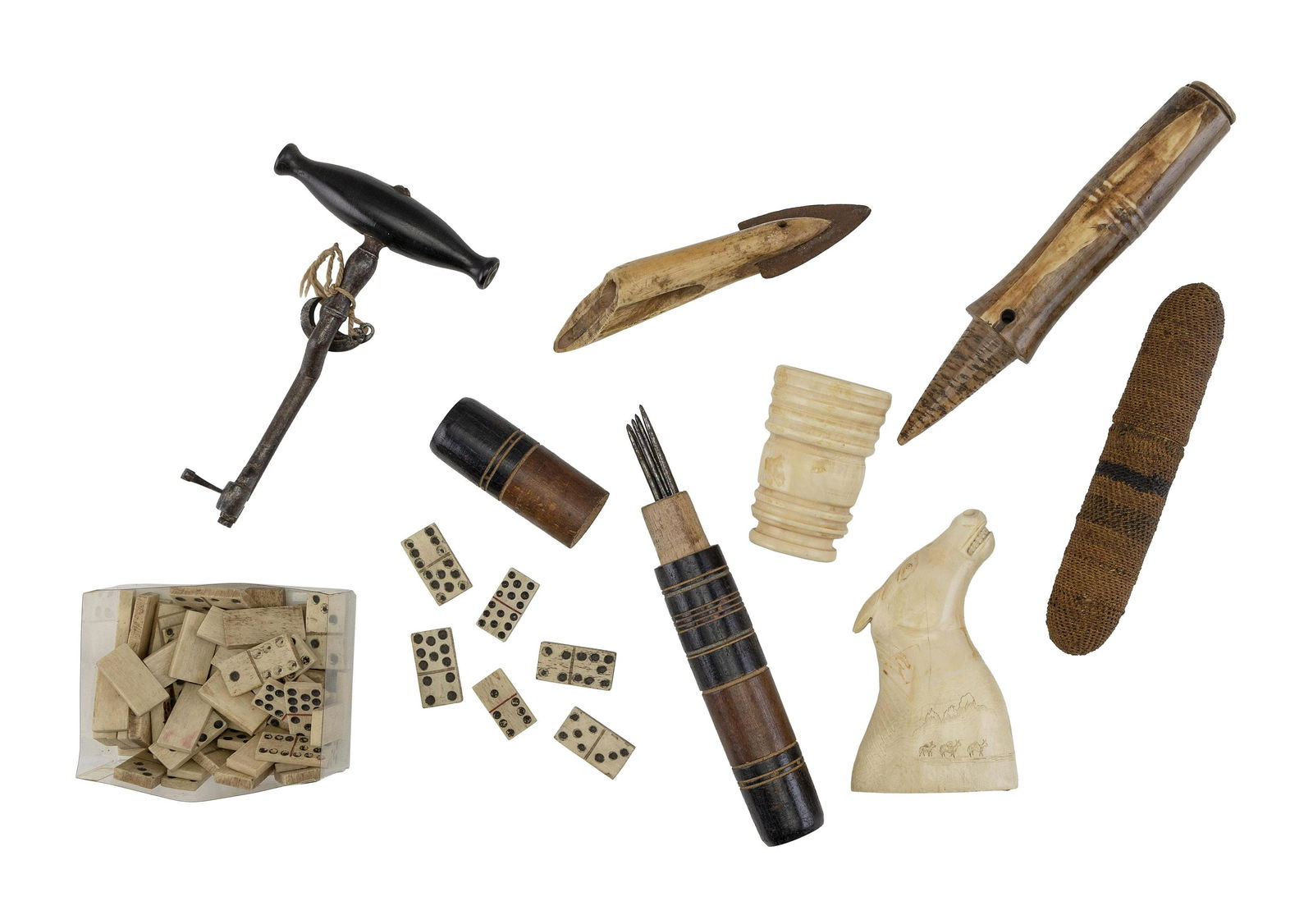 EIGHT ASSORTED UTILITARIAN OR GAMING ITEMS Mid-19th to Early 20th Century Lengths from 2.75”: EIGHT ASSORTED UTILITARIAN OR GAMING ITEMSMid-19th to Early 20th CenturyTwo needle cases, a turned cup, an Inuit whale ivory carved horse head, bone dominoes, a fish spear, a tooth extractor and a pet