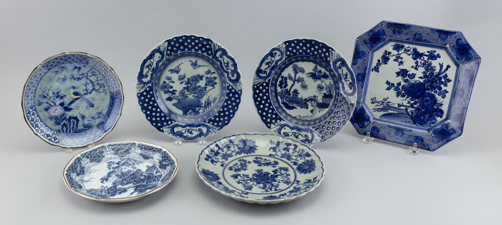 SIX ASSORTED JAPANESE BLUE AND WHITE PLATES Early 20th Century Diameters and lengths from 9.5” (1 of 2)