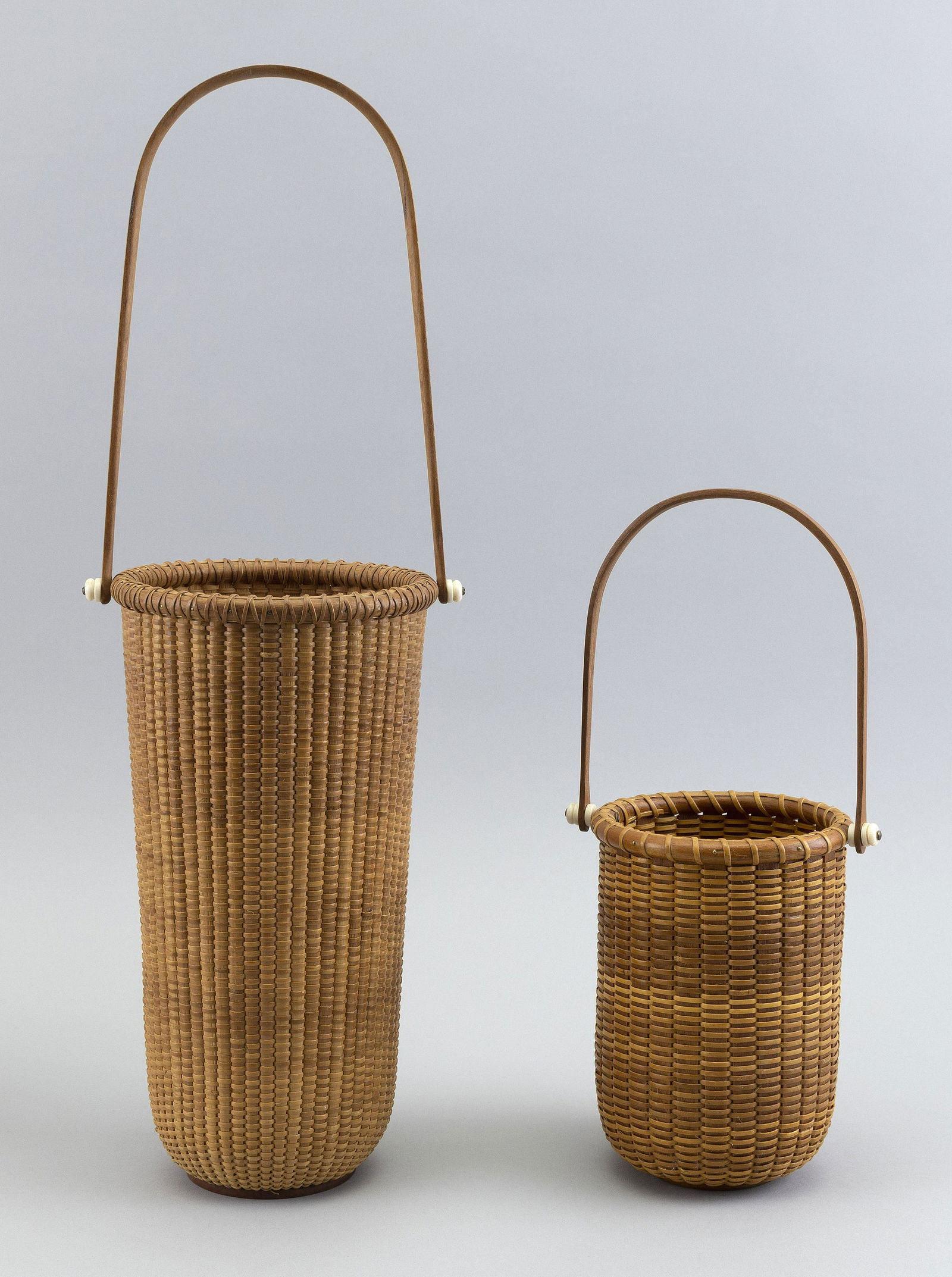 TWO NANTUCKET-STYLE BASKETS Contemporary Heights to rims 6.75” and 10.75”. (1 of 2)