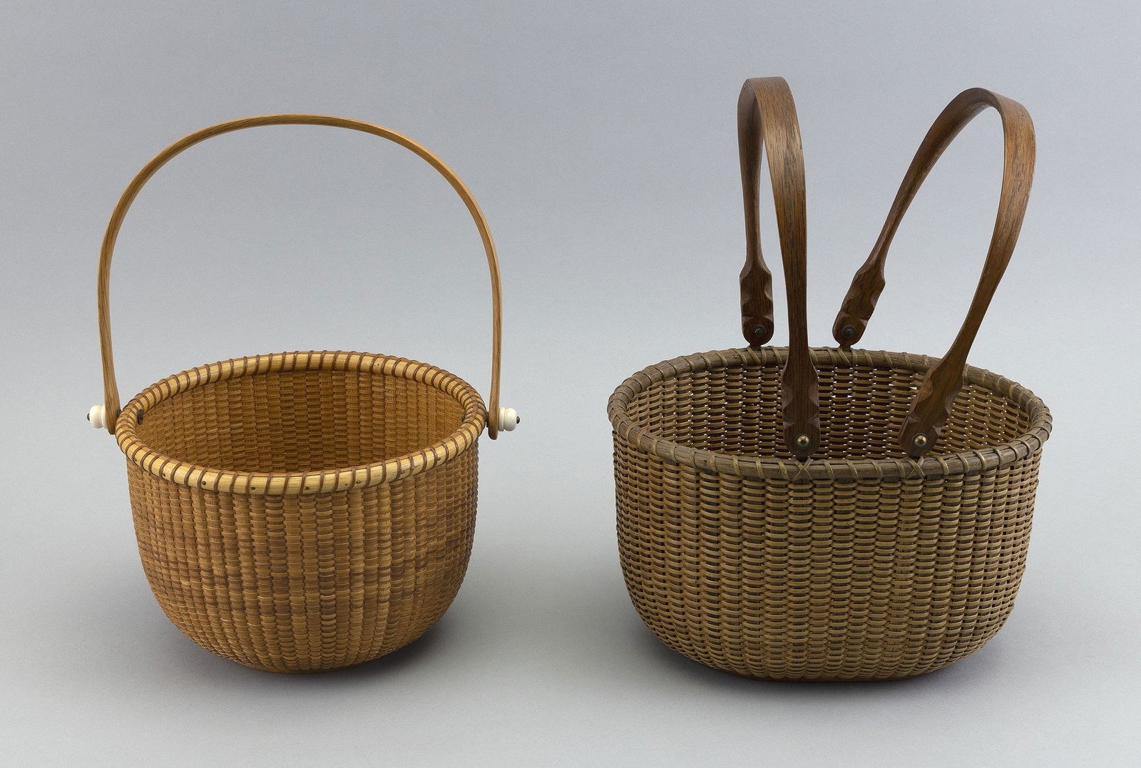 TWO NANTUCKET BASKETS Contemporary Heights to rims 5” and 5.25”. Lengths 7.25” and (1 of 2)