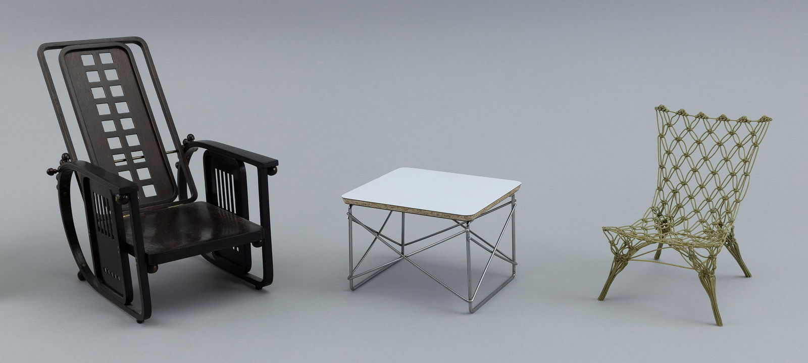 THREE PIECES OF VITRA DESIGN MUSEUM MINIATURE FURNITURE 20th Century Heights from 2.75" to 7".: THREE PIECES OF VITRA DESIGN MUSEUM MINIATURE FURNITURE20th Century1) Marcel Wanders Knotted Chair in green carbon fiber and resin. Includes original crate but no brochure.2) Josef Hoffmann Nr. 670 Si