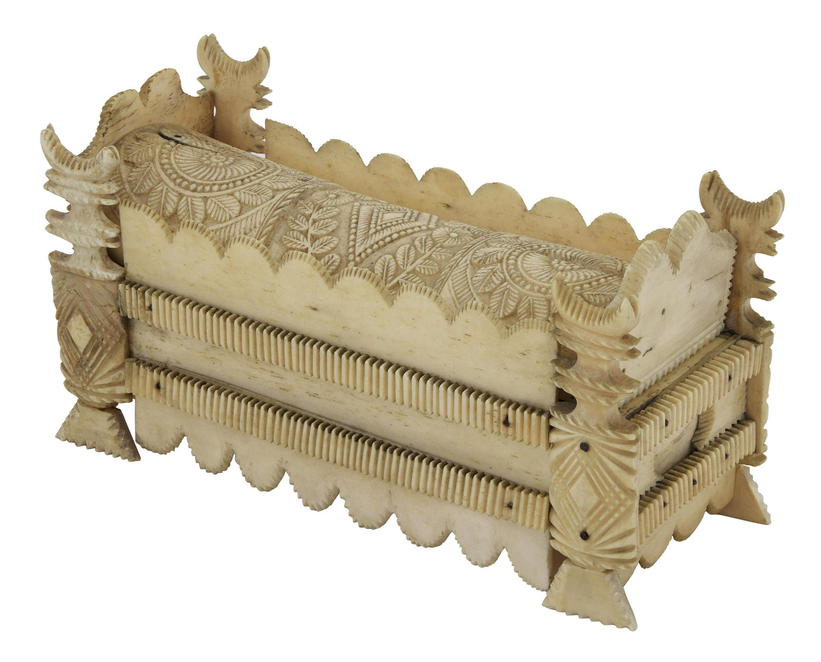 NAPOLEONIC PRISONER-OF-WAR BONE GAMES BOX Early 19th Century Height 3.5î. Length 6.75î.: NAPOLEONIC PRISONER-OF-WAR BONE GAMES BOX Early 19th Century Sliding domed cover with extensive foliate and geometric carvings. Secondary sliding lid with pierced cribbage board and coordinating carve