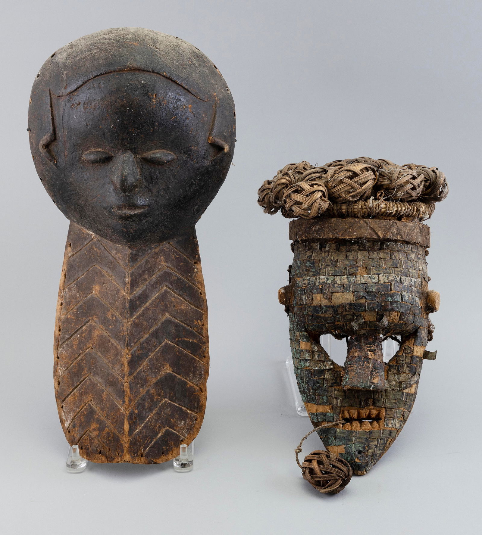 TWO AFRICAN CARVED WOOD MASKS Heights approx. 17". (1 of 2)