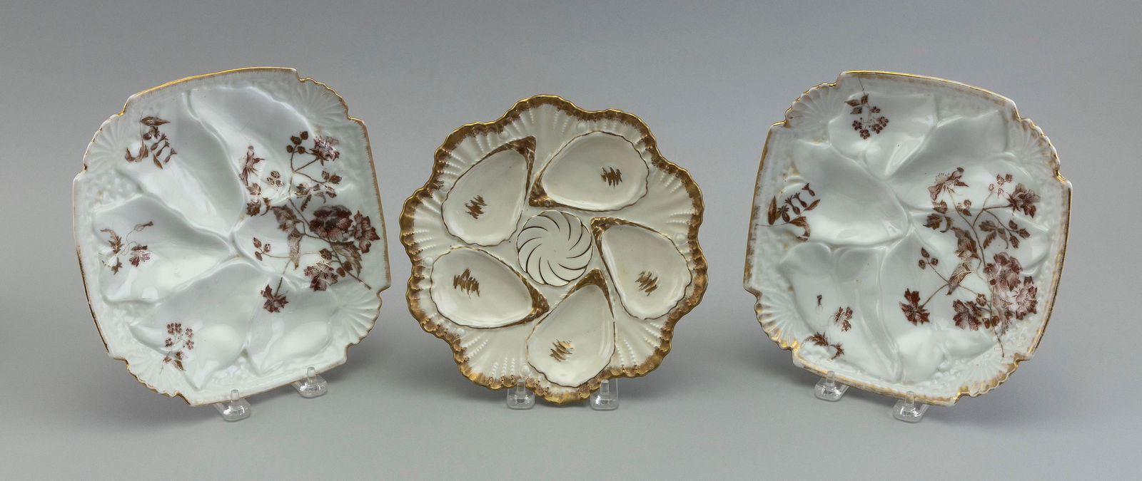 THREE PORCELAIN OYSTER PLATES First Half of the 20th Century Diameters 8.25î and 8.75î. (1 of 2)