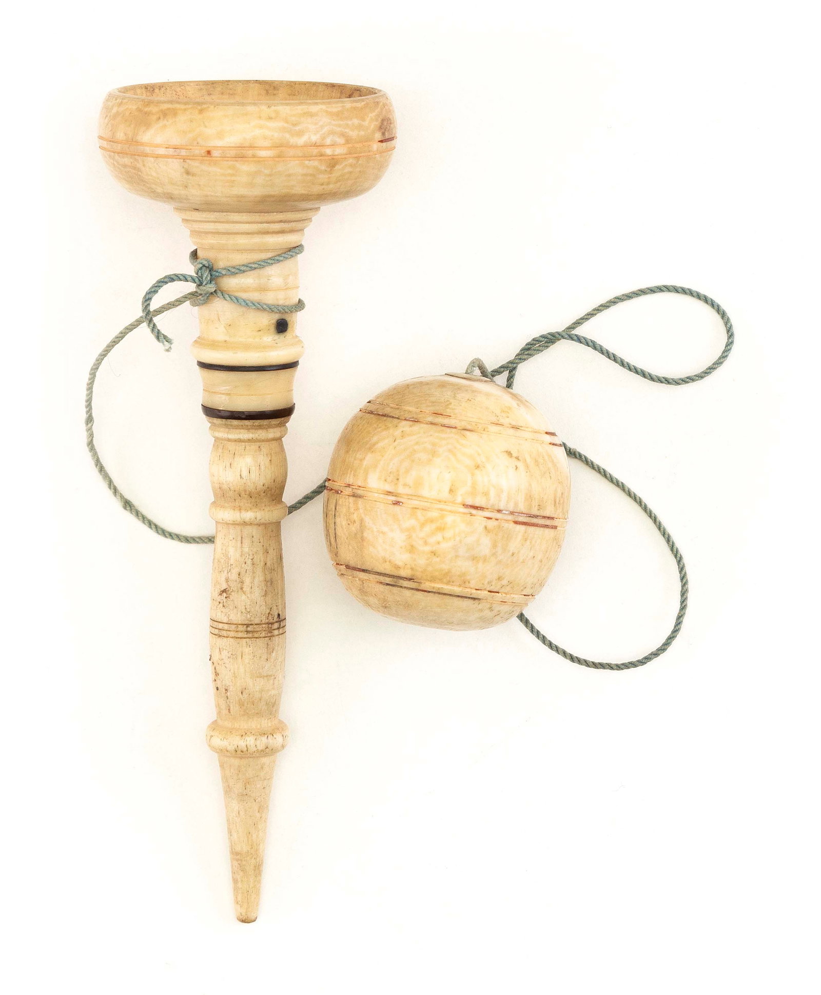 WHALEBONE AND WHALE IVORY CHILD'S BALL AND CUP TOY 19th Century Length 6.25".: WHALEBONE AND WHALE IVORY CHILD'S BALL AND CUP TOY 19th Century Beautifully turned handle. Cup and ball with incised banding. Length 6.25".
