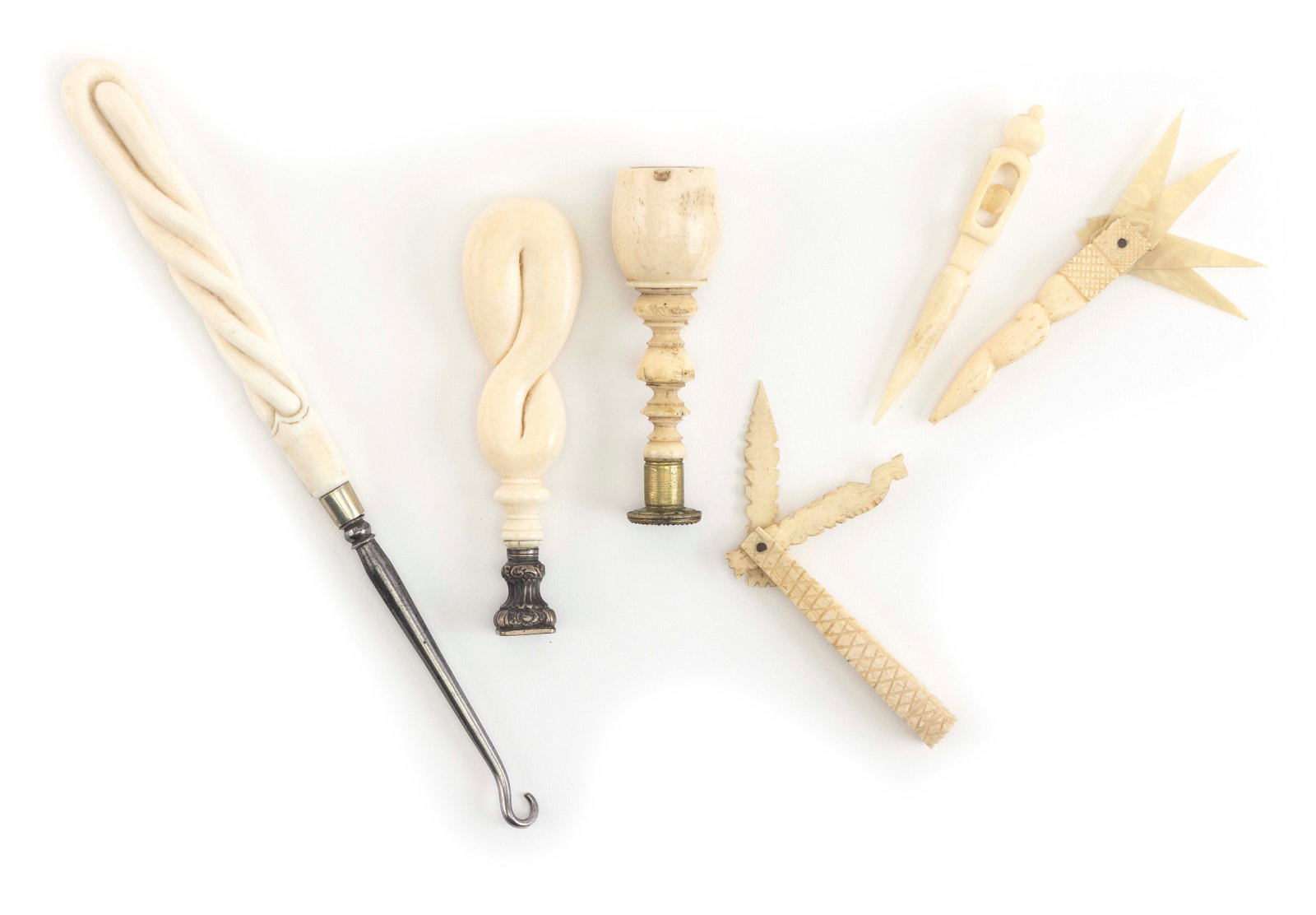 SIX SEWING AND LETTER IMPLEMENTS 19th Century Lengths from 2.5" to 8.5".: SIX SEWING AND LETTER IMPLEMENTS 19th Century All with bone or ivory handles. Includes a buttonhook, two wax seals, two bodkins and a sewing knife. Lengths from 2.5" to 8.5".