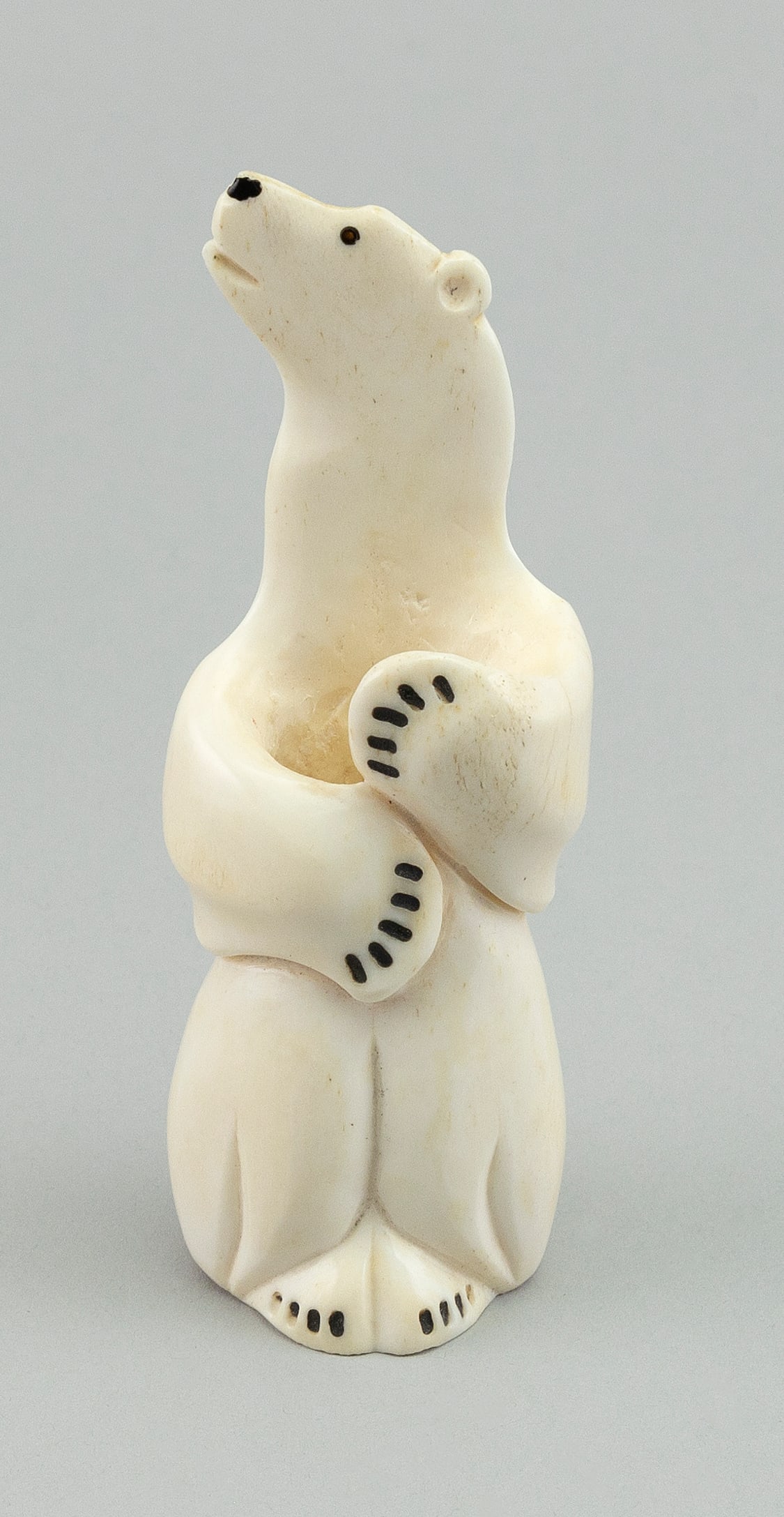 ESKIMO WALRUS IVORY CARVING OF A POLAR BEAR First Half of the 20th Century Height 5î.: ESKIMO WALRUS IVORY CARVING OF A POLAR BEAR First Half of the 20th Century Possibly made as a pen holder. Height 5î.