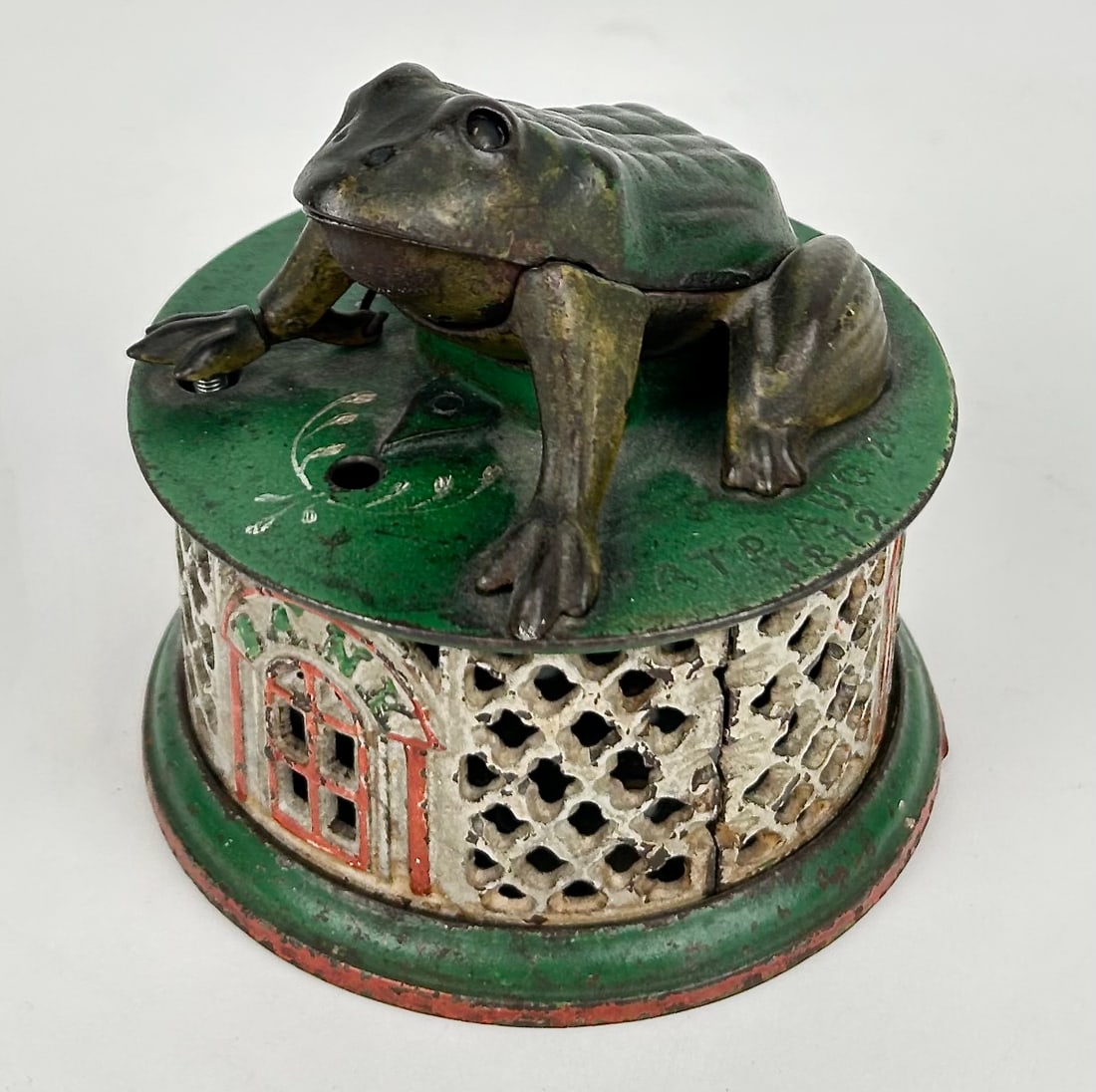 FROG ON LATTICE CAST IRON MECHANICAL BANK 19th Century Diameter 4.5".: "FROG ON LATTICE" CAST IRON MECHANICAL BANK 19th Century By J. & E. Stevens, Cromwell, Connecticut. Diameter 4.5".