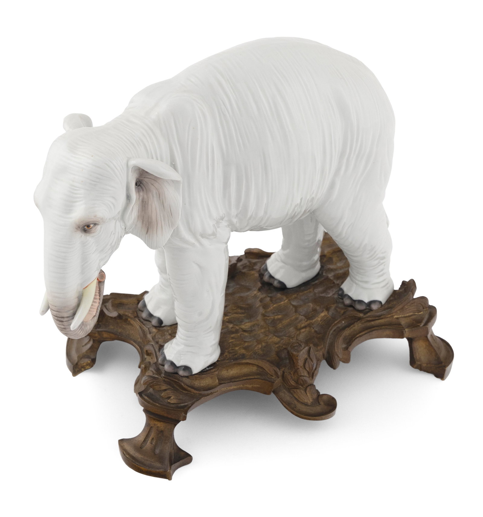 PORCELAIN ELEPHANT WITH ORMOLU-MOUNTED BASE 19th Century Height 11î. Length 12î. Width: PORCELAIN ELEPHANT WITH ORMOLU-MOUNTED BASE 19th Century Possibly Meissen. Unmarked. Height 11î. Length 12î. Width 7î.
