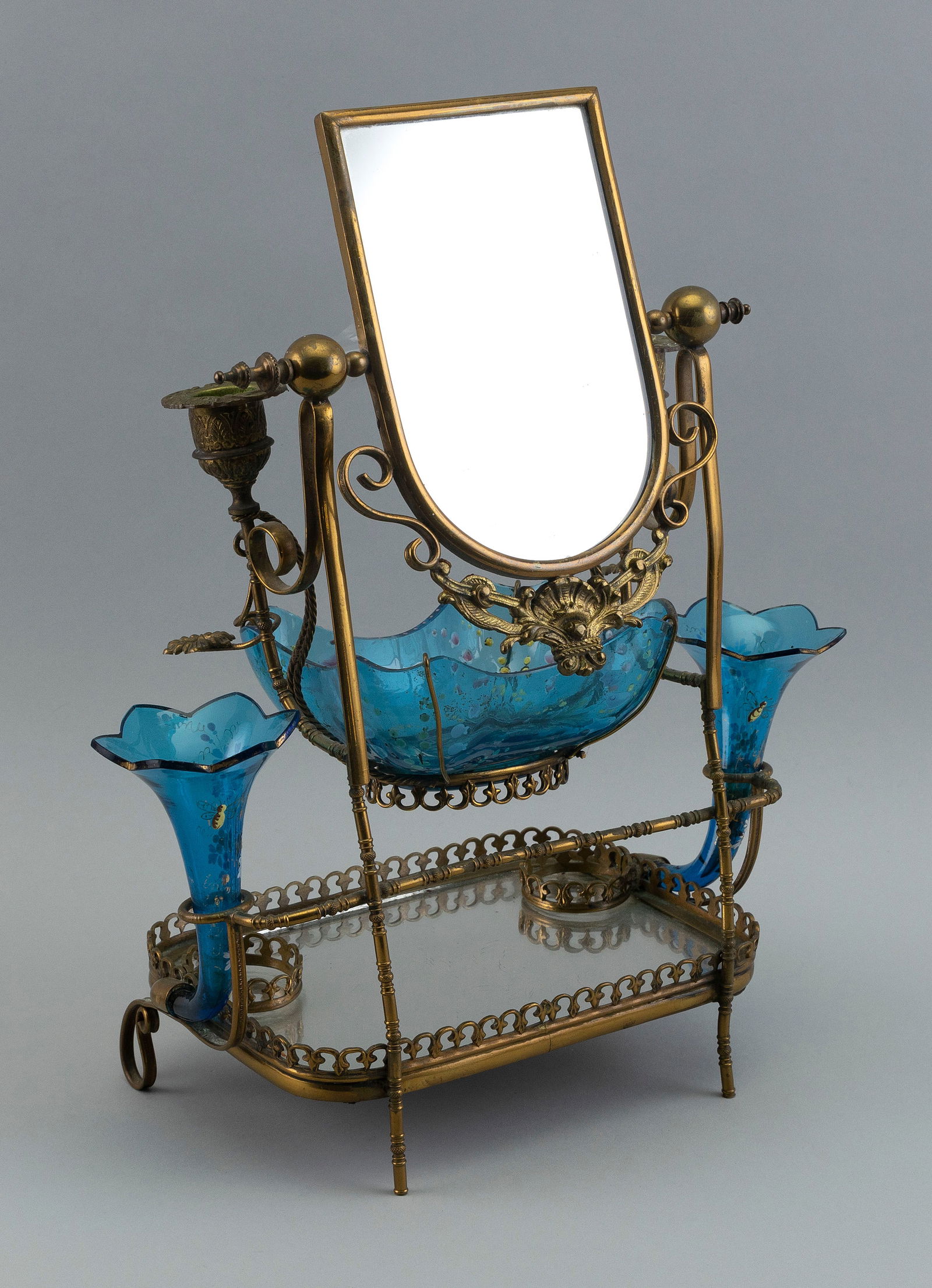 FRENCH VANITY 19th Century Height 17". Width 12".: FRENCH VANITY19th CenturyWith brass wire tilting mirror, a pair of candle sconces, an aqua painted glass perfume bowl and matching pair of epergnes, and scrolled feet.Height 17". Width 12".